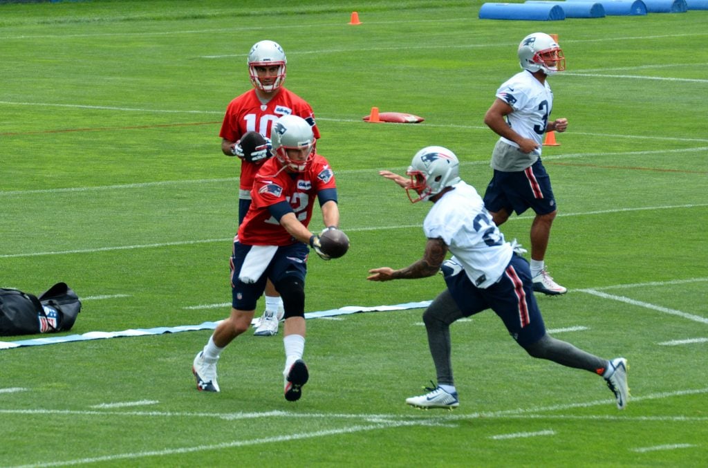 Foster takes a handoff inside the "triangle" from Tom Brady