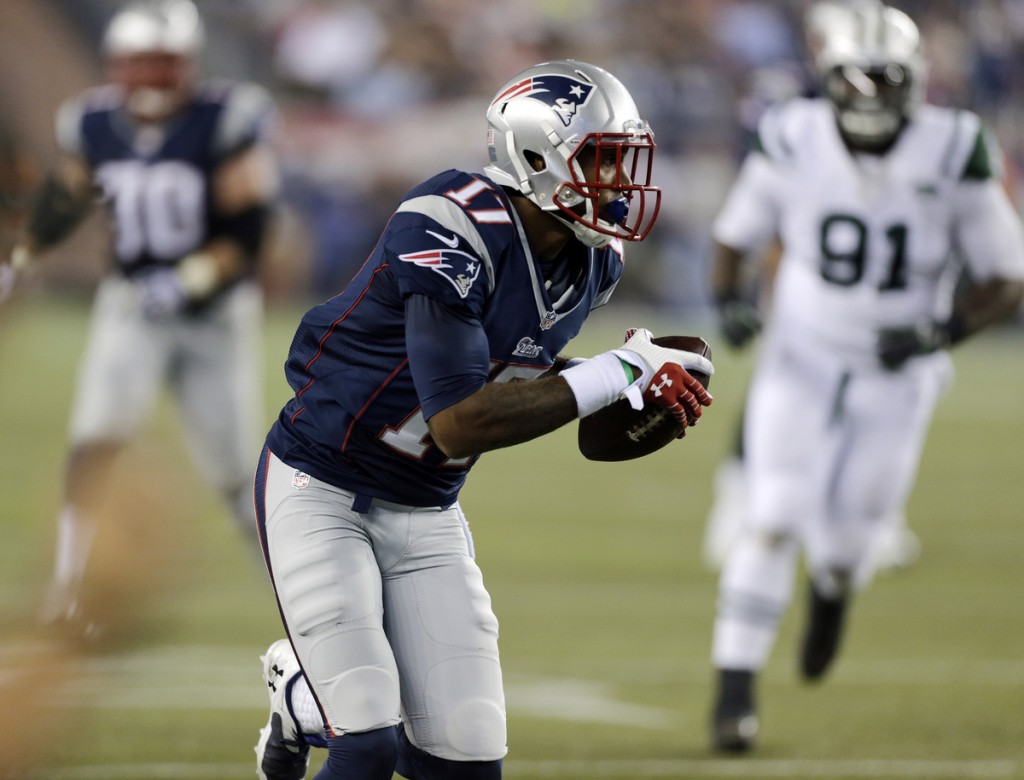 New England Patriots wide receiver Aaron Dobson heads for the goal with a first-quarter touchdown in an NFL football game Thursday, Sept. 12, 2013, in Foxborough, Mass. (AP Photo/Charles Krupa)
