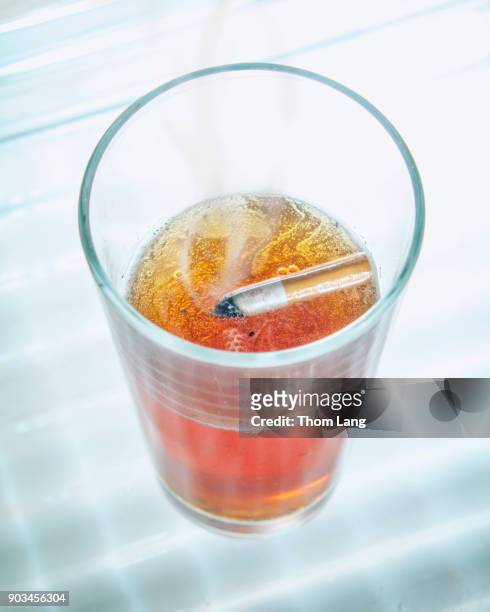 glass-of-beer-with-a-cigarette-butt-floating-in-it.jpg