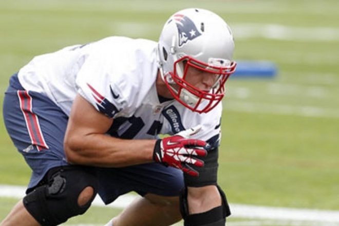 PHOTO: Bill Belichick and Rob Gronkowski Exchange a High Five During Practice