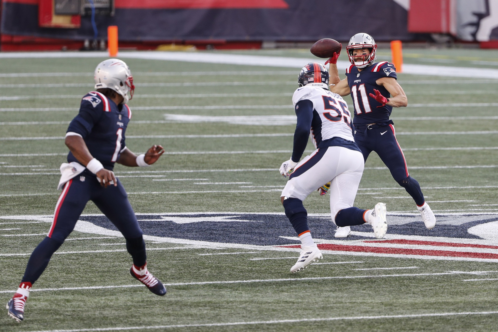 Oct 18, 2020; Foxborough, Massachusetts, USA; New England Patriots wide receiver Julian Edelman (11) throws a pass over Denver Broncos linebacker Bradley Chubb (55) to quarterback Cam Newton (1) during the second half at Gillette Stadium. Mandatory Credit: Winslow Townson-USA TODAY Sports