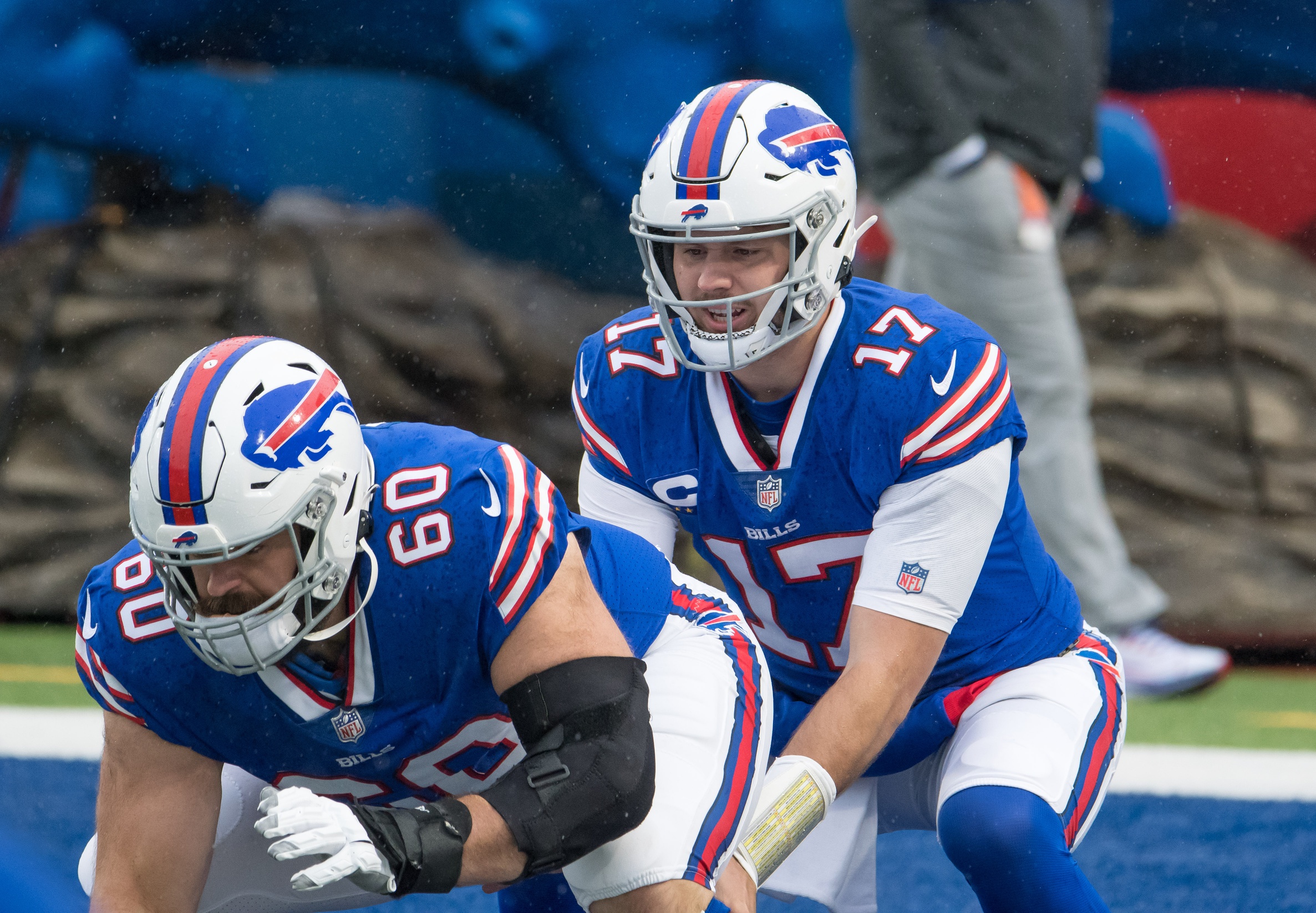 Nov 1, 2020; Orchard Park, New York, USA; Buffalo Bills quarterback Josh Allen (17) warms up with center Mitch Morse (60) before a game against the New England Patriots at Bills Stadium. Mandatory Credit: Mark Konezny-USA TODAY Sports