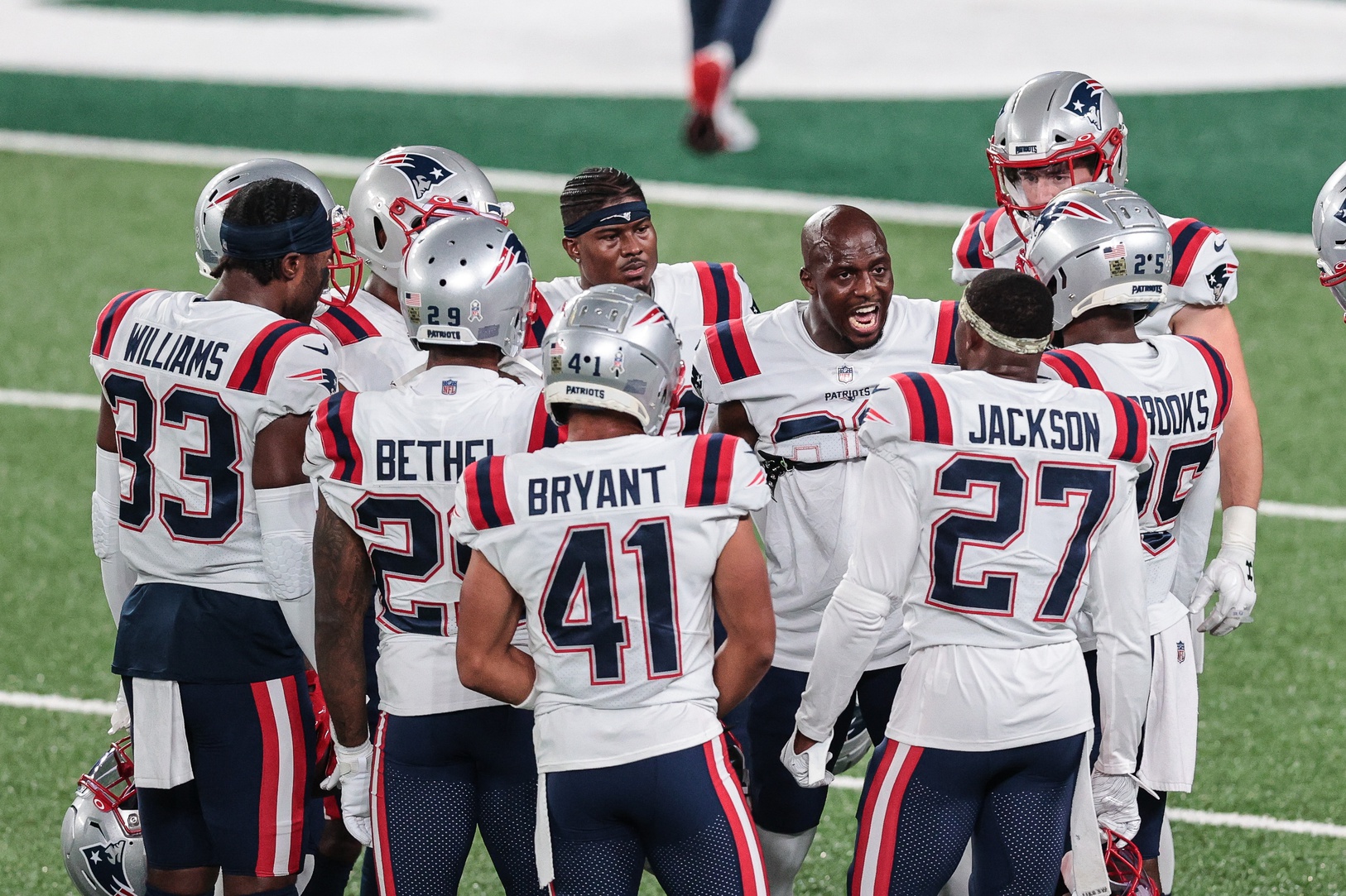 Nov 9, 2020; East Rutherford, New Jersey, USA; New England Patriots free safety Devin McCourty (32) talks with teammates before their game against the New York Jets at MetLife Stadium. Mandatory Credit: Vincent Carchietta-USA TODAY Sports