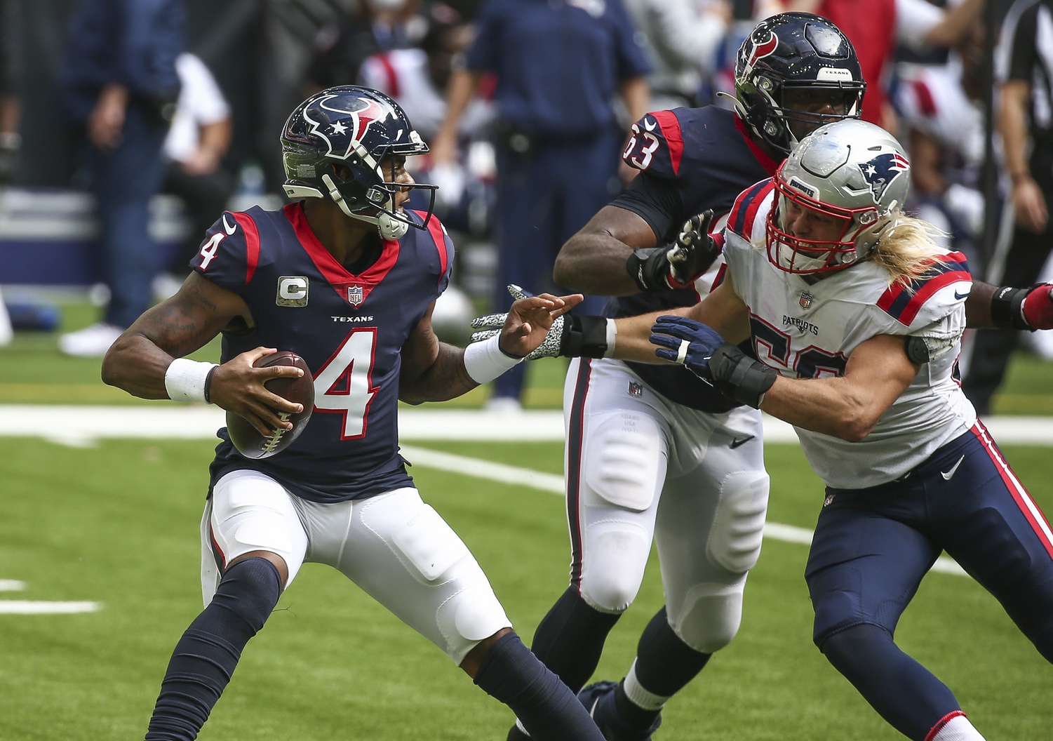 Nov 22, 2020; Houston, Texas, USA; Houston Texans quarterback Deshaun Watson (4) scrambles with the ball as New England Patriots defensive end Chase Winovich (50) applies defensive pressure during the second quarter at NRG Stadium. Mandatory Credit: Troy Taormina-USA TODAY Sports