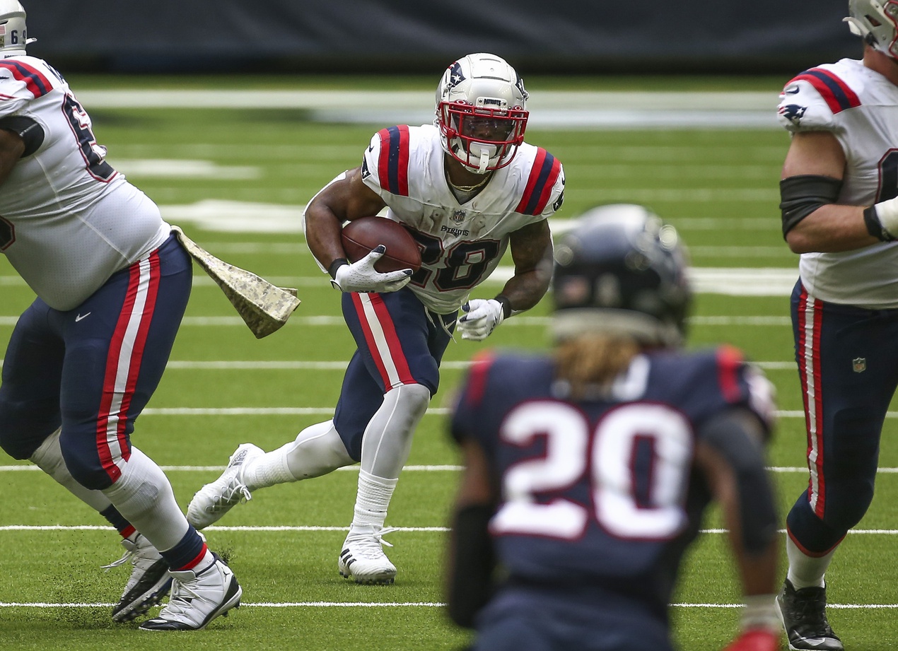 Nov 22, 2020; Houston, Texas, USA; New England Patriots running back James White (28) runs with the ball during the fourth quarter against the Houston Texans at NRG Stadium. Mandatory Credit: Troy Taormina-USA TODAY Sports