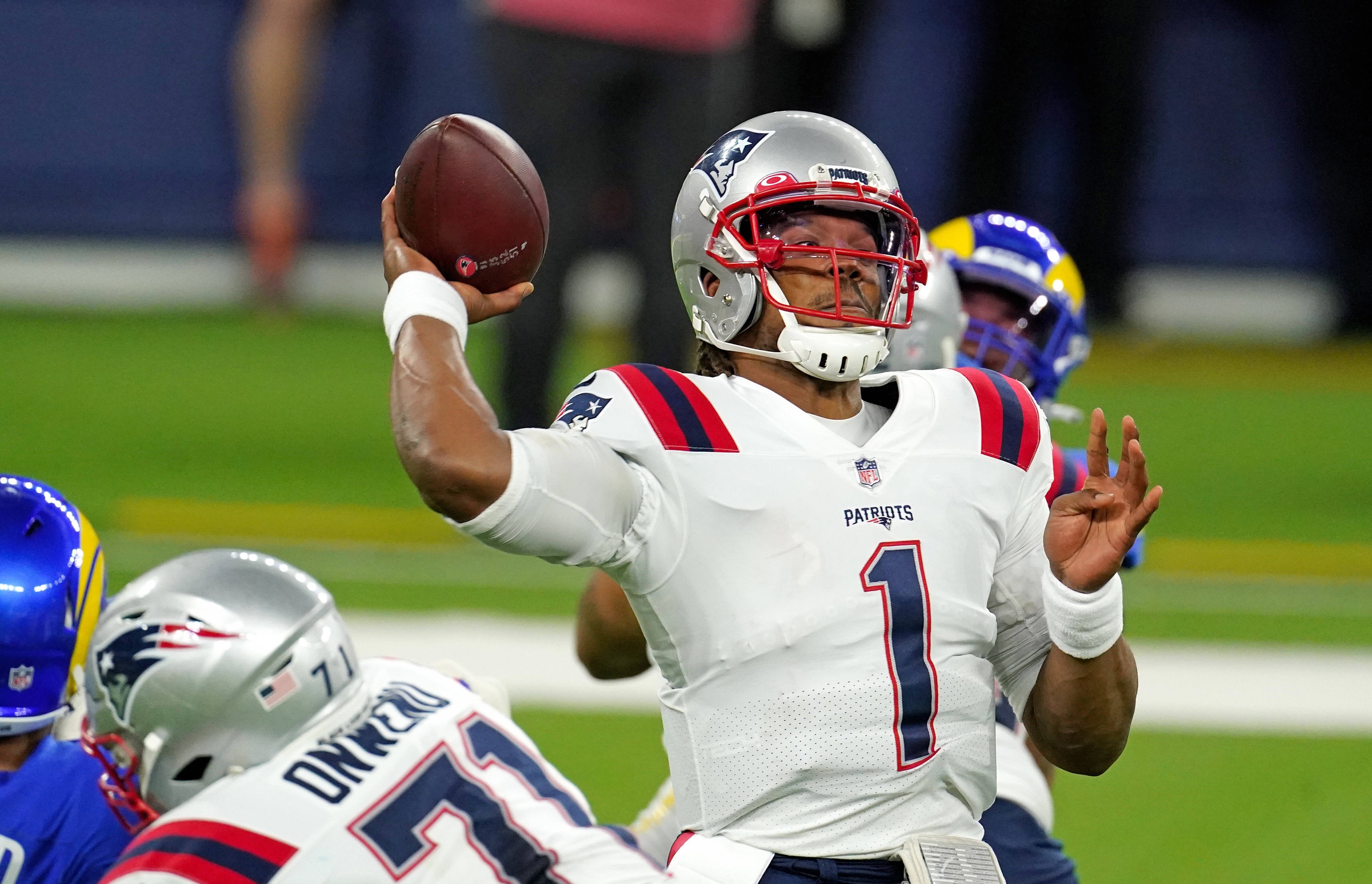 Dec 10, 2020; Inglewood, California, USA; New England Patriots quarterback Cam Newton (1) throws a pass against the Los Angeles Rams during the first half at SoFi Stadium. Mandatory Credit: Kirby Lee-USA TODAY Sports
