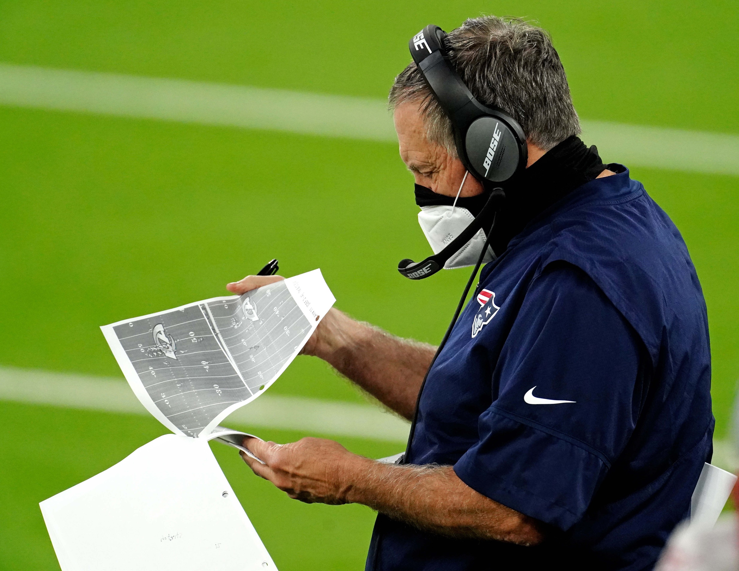 Dec 10, 2020; Inglewood, California, USA; New England Patriots head coach Bill Belichick looks at different plays during the first half against the Los Angeles Rams at SoFi Stadium. Mandatory Credit: Kirby Lee-USA TODAY Sports