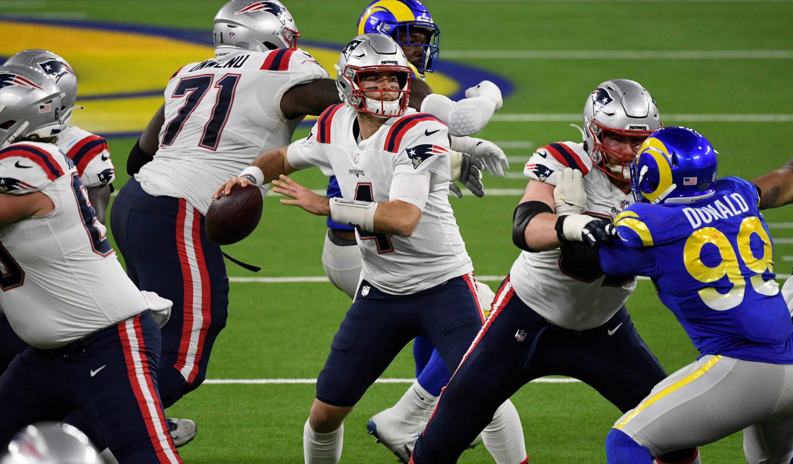 Dec 10, 2020; Inglewood, California, USA; New England Patriots quarterback Jarrett Stidham (4) throws a pass against the Los Angeles Rams during the fourth quarter at SoFi Stadium. Mandatory Credit: Robert Hanashiro-USA TODAY Sports