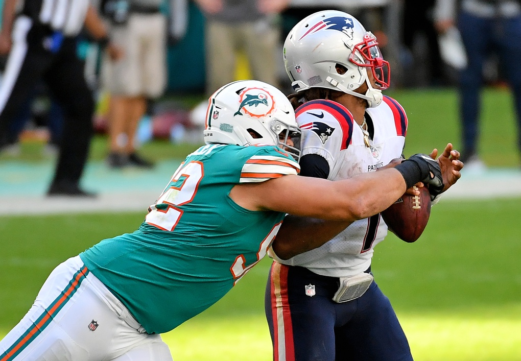 Dec 20, 2020; Miami Gardens, Florida, USA; Miami Dolphins defensive end Zach Sieler (92) sacks New England Patriots quarterback Cam Newton (1) during the second half at Hard Rock Stadium. Mandatory Credit: Jasen Vinlove-USA TODAY Sports