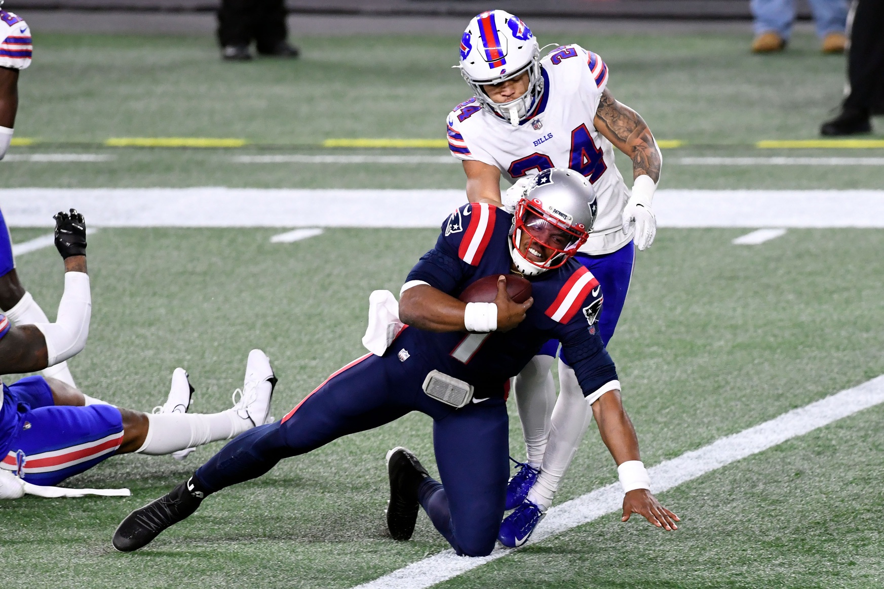 Dec 28, 2020; Foxborough, Massachusetts, USA; New England Patriots quarterback Cam Newton (1) runs for a touchdown in front of Buffalo Bills cornerback Taron Johnson (24) during the second quarter at Gillette Stadium. Mandatory Credit: Brian Fluharty-USA TODAY Sports