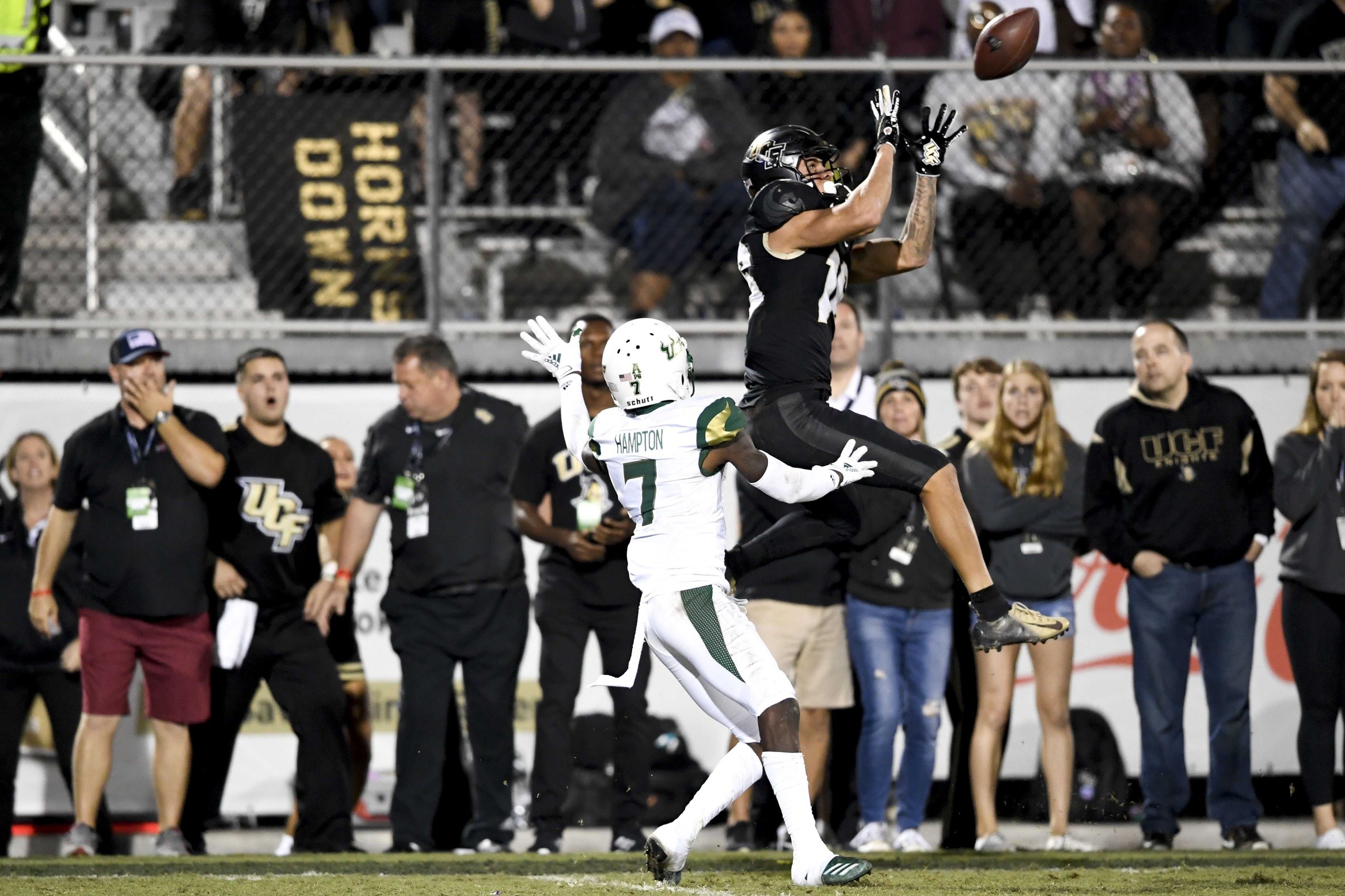 Nov 29, 2019; Orlando, FL, USA; Central Florida Knights wide receiver Tre Nixon (16) makes a reception in front of South Florida Bulls defensive back Mike Hampton (7) during the second half at Spectrum Stadium. Mandatory Credit: 