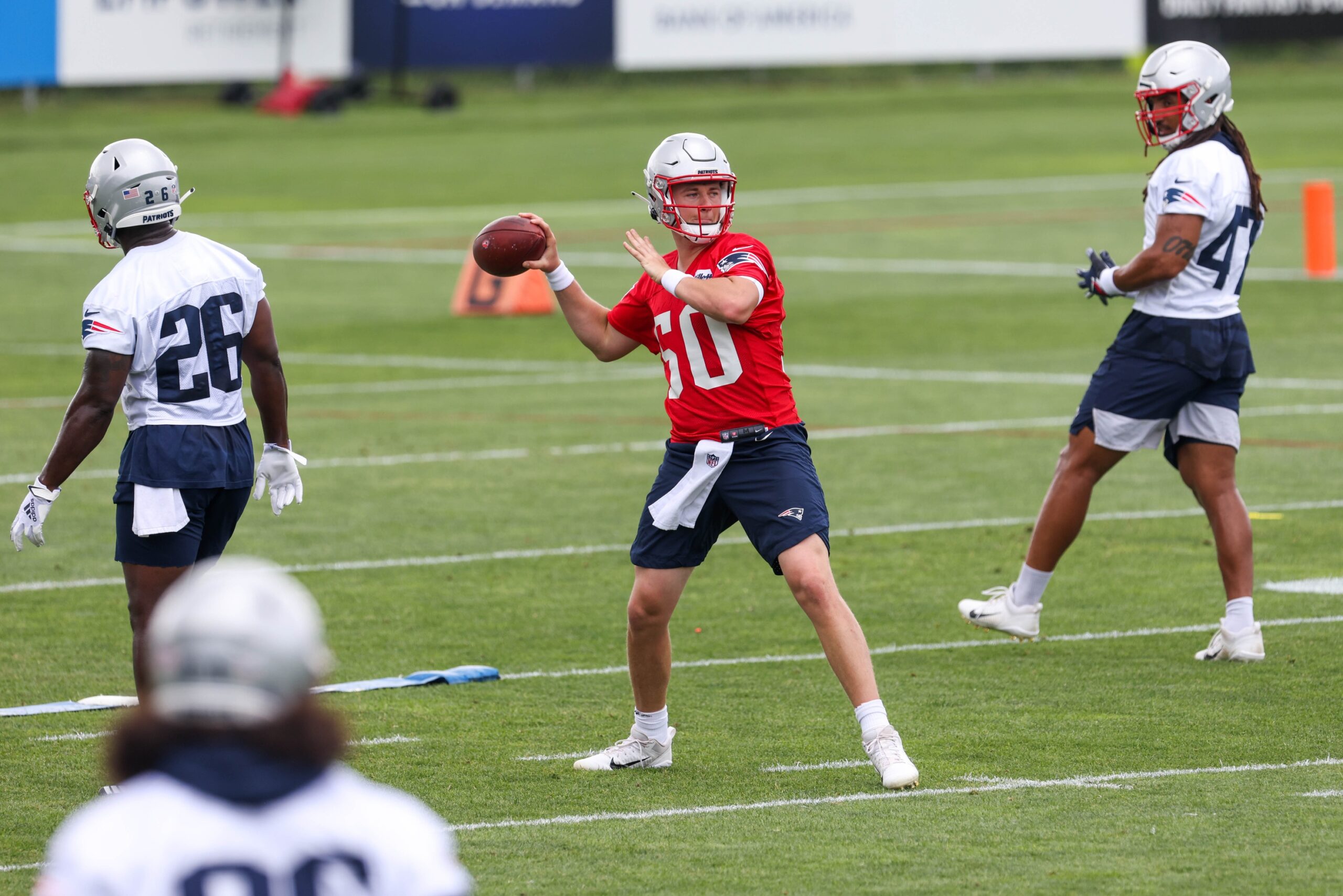 Jun 15, 2021; Foxborough, MA, USA; New England Patriots quarterback Mac Jones (50) participates in a drill during the New England Patriots mini camp at the New England Patriots practice complex. Mandatory Credit: Paul Rutherford-USA TODAY Sports