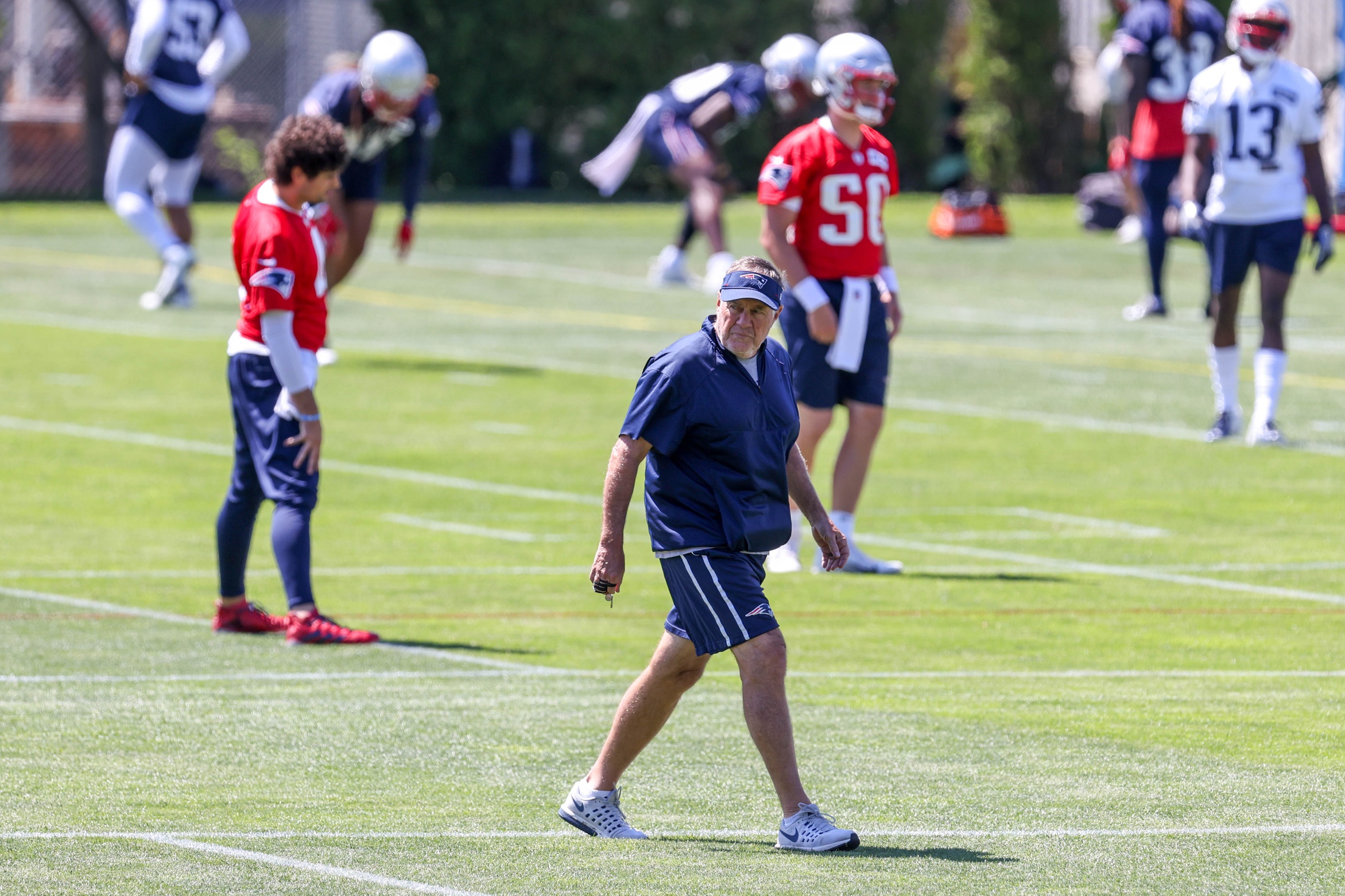 Jun 16, 2021; Foxborough, MA, USA; New England Patriots head coach Bill Belichick reacts during the New England Patriots mini camp at the New England Patriots practice complex. Mandatory Credit: Paul Rutherford-USA TODAY Sports