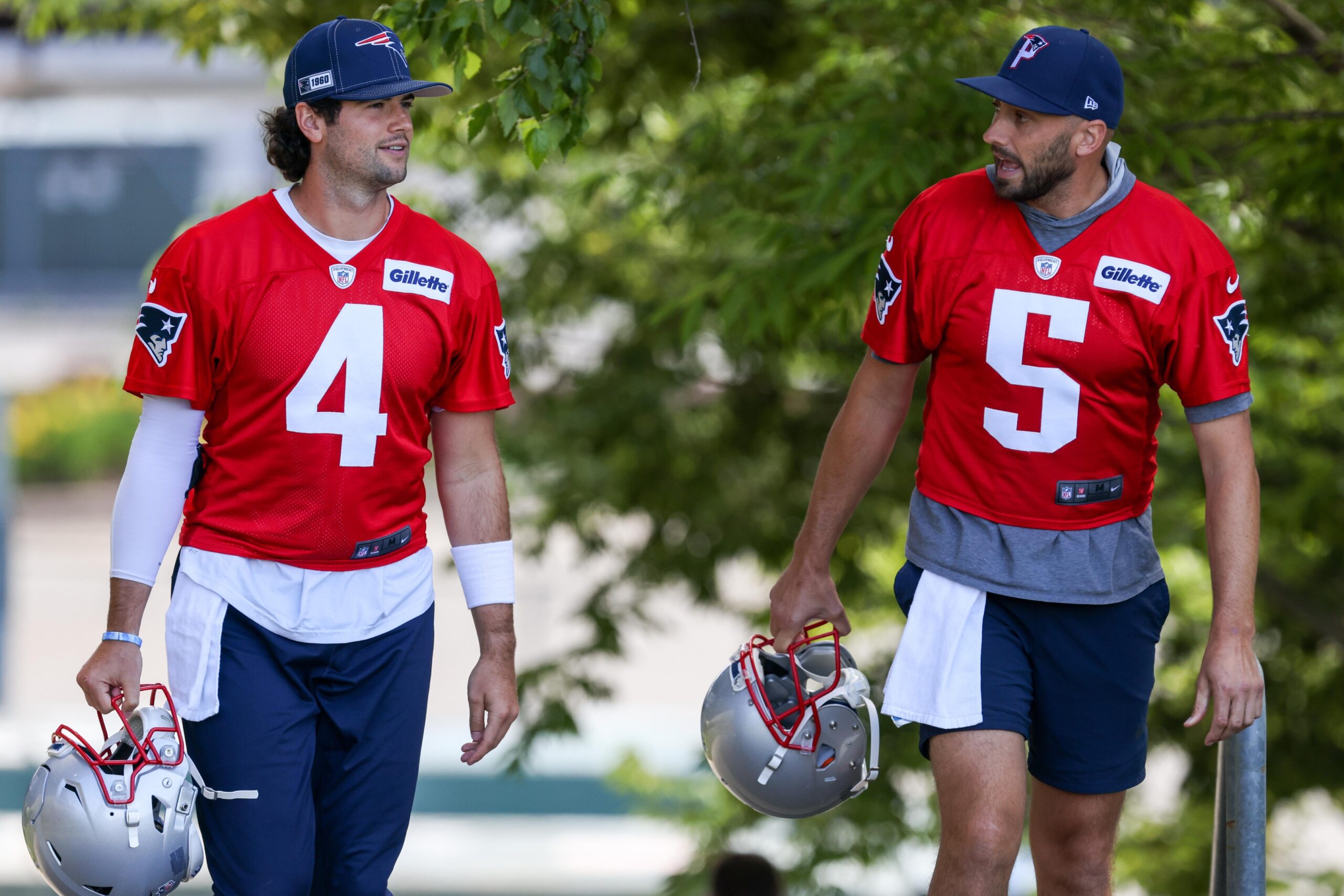 Jun 16, 2021; Foxborough, MA, USA; New England Patriots quarterbacks Jarrett Stidham (4) and Brian Hoyer react during the New England Patriots mini camp at the New England Patriots practice complex. Mandatory Credit: Paul Rutherford-USA TODAY Sports