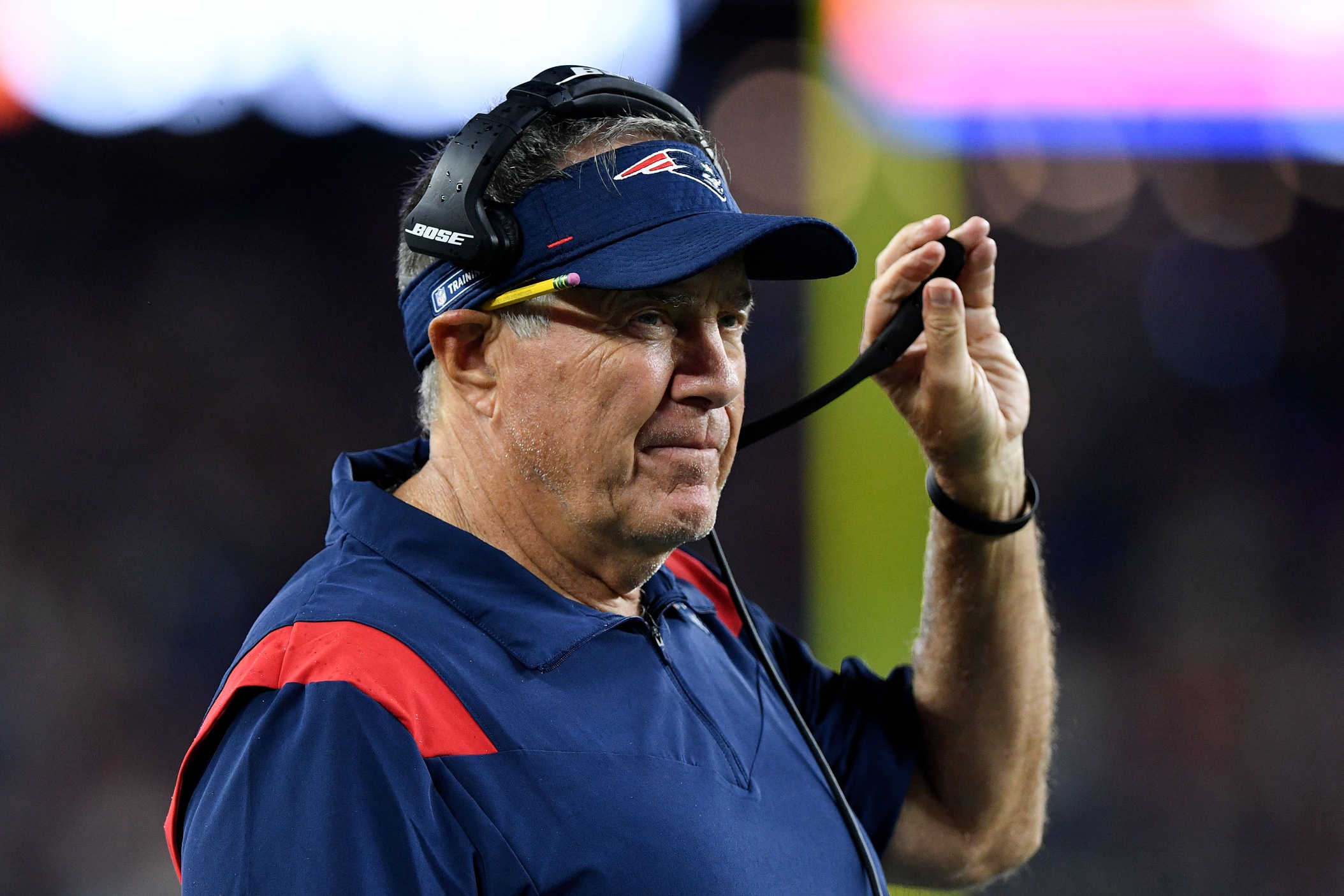 Aug 12, 2021; Foxborough, Massachusetts, USA; New England Patriots head coach Bill Belichick watches a game against the Washington Football Team during the first half at Gillette Stadium. Mandatory Credit: Brian Fluharty-USA TODAY Sports