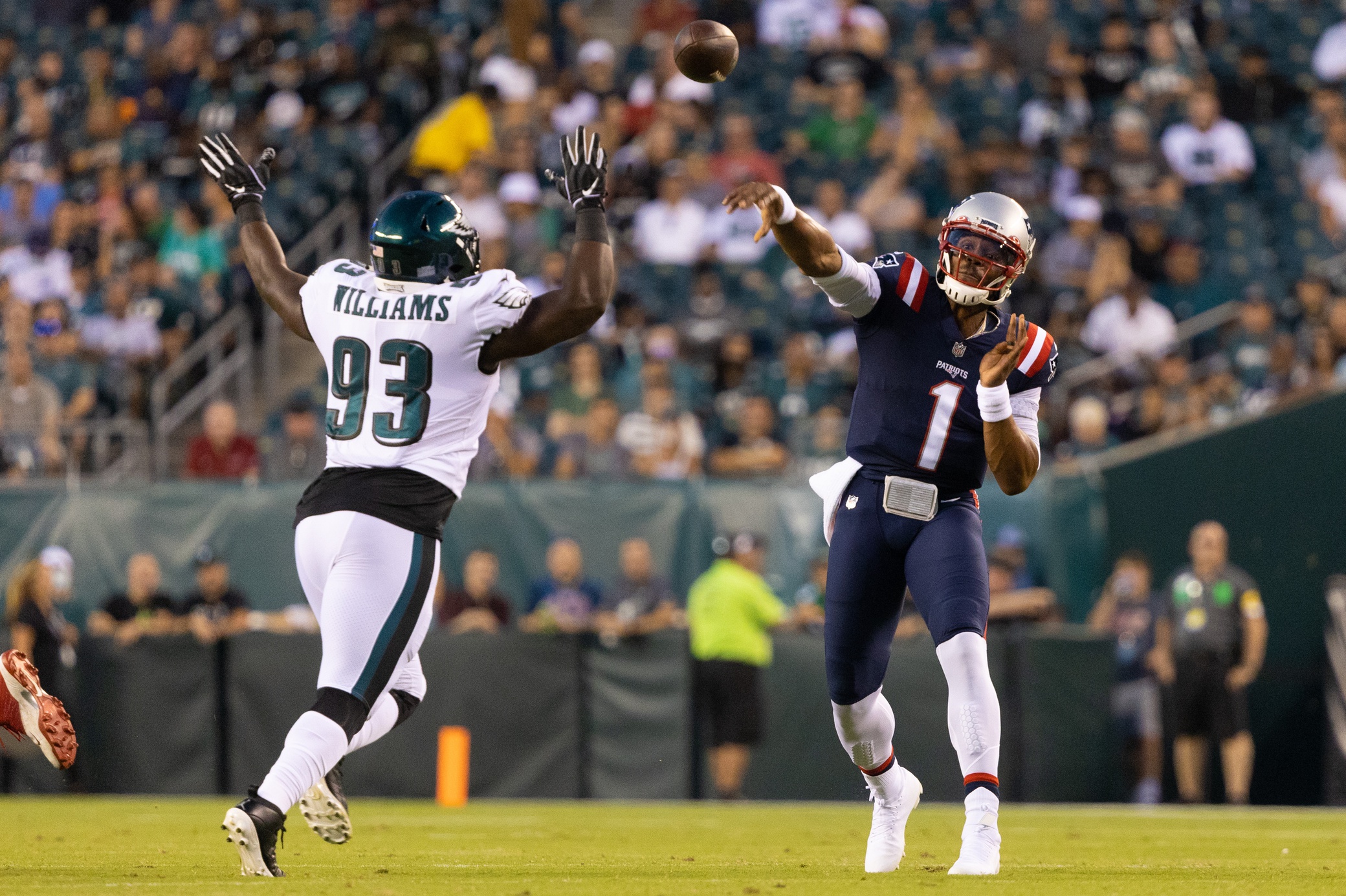 Aug 19, 2021; Philadelphia, Pennsylvania, USA; New England Patriots quarterback Cam Newton (1) passes the ball against Philadelphia Eagles defensive tackle Milton Williams (93) during the first quarter at Lincoln Financial Field. Mandatory Credit: Bill Streicher-USA TODAY Sports