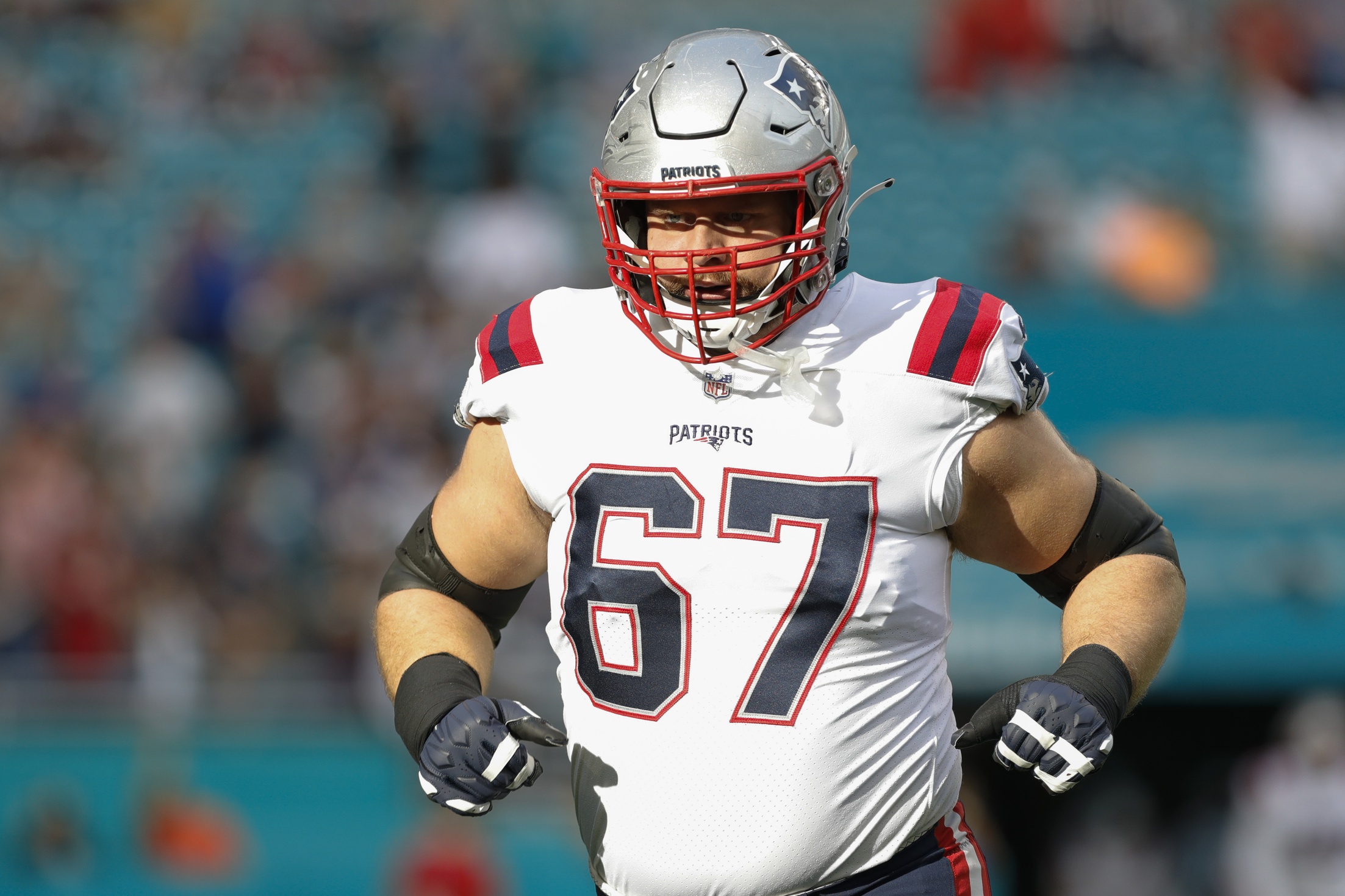 Jan 9, 2022; Miami Gardens, Florida, USA; New England Patriots guard Ted Karras (67) takes on the field prior to the game against the Miami Dolphins at Hard Rock Stadium. Mandatory Credit: Sam Navarro-USA TODAY Sports