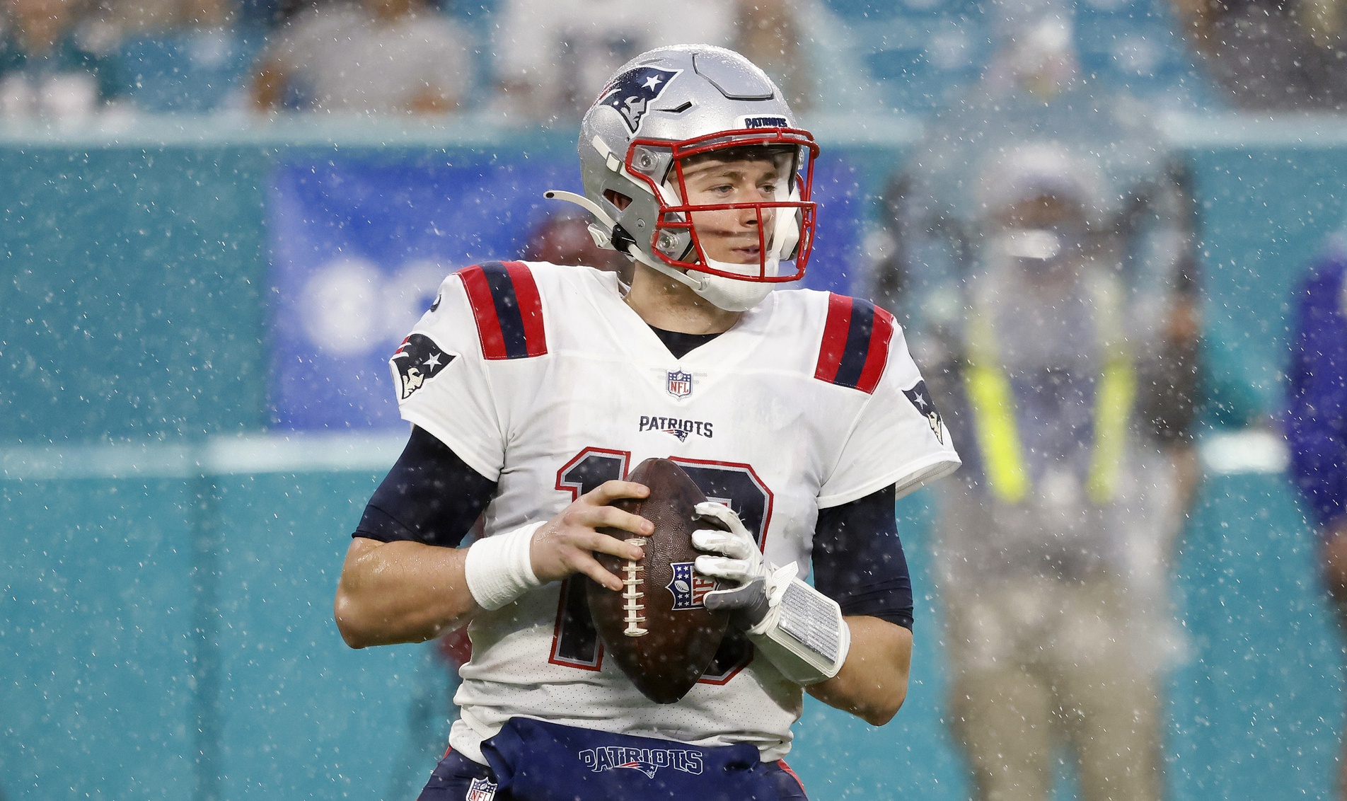 Jan 9, 2022; Miami Gardens, Florida, USA; New England Patriots quarterback Mac Jones (10) attempts to throw the football against the Miami Dolphins during the second quarter at Hard Rock Stadium. Mandatory Credit: Rhona Wise-USA TODAY Sports