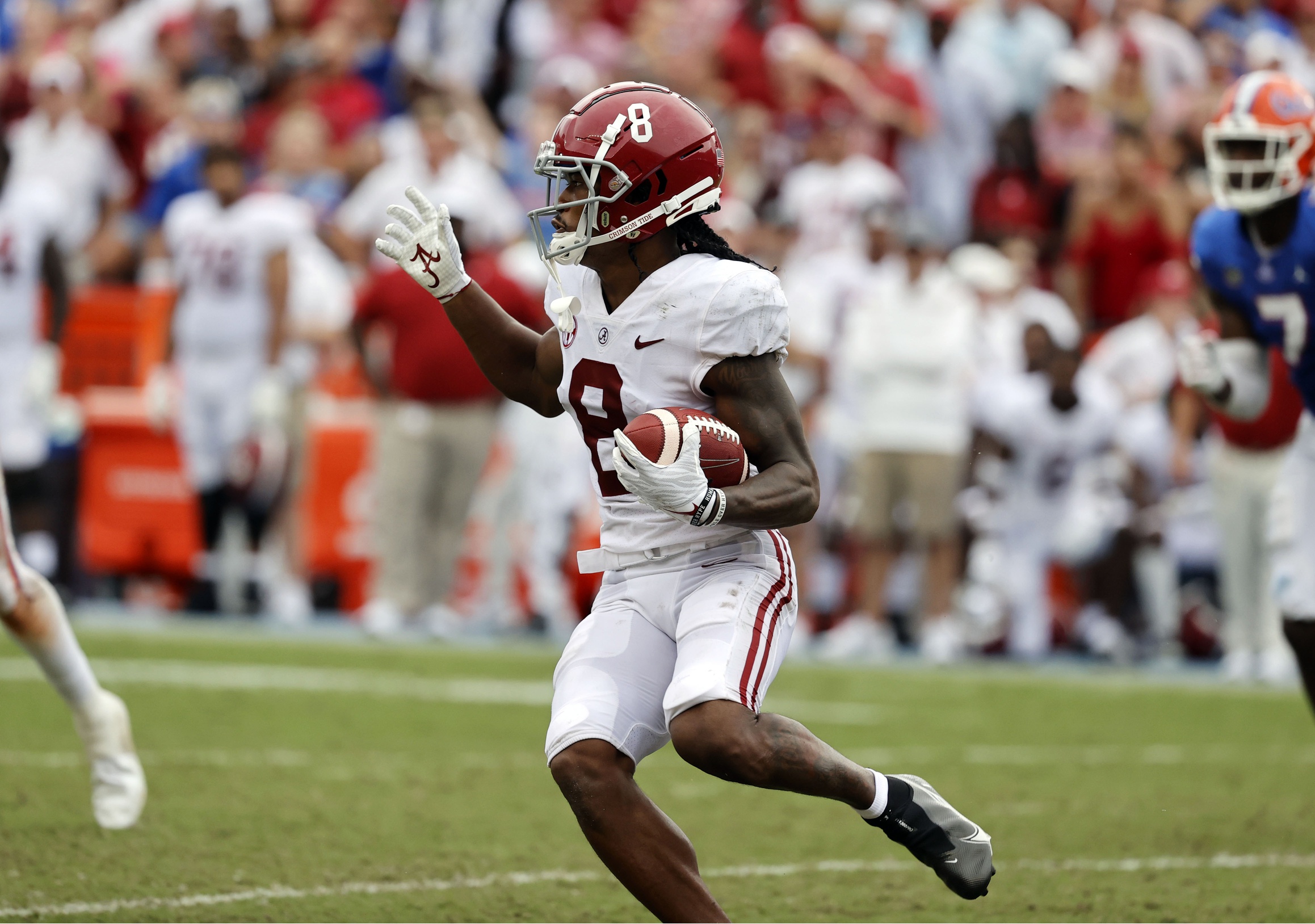 Sep 18, 2021; Gainesville, Florida, USA; Alabama Crimson Tide wide receiver John Metchie III (8) runs with the ball against the Florida Gators during the first half at Ben Hill Griffin Stadium. Mandatory Credit: Kim Klement-USA TODAY Sports