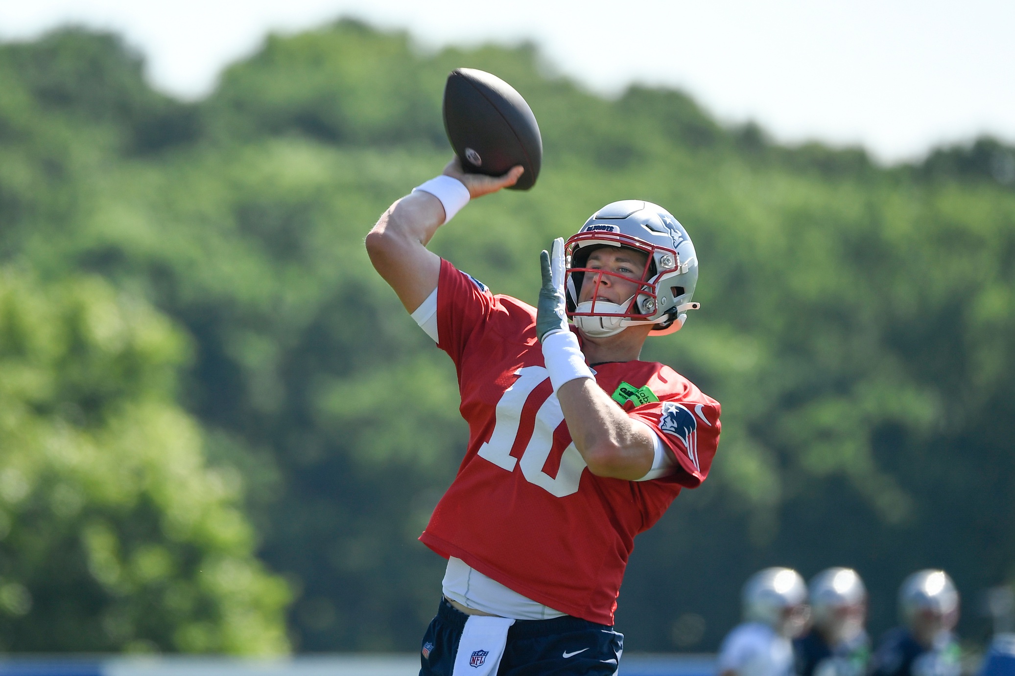 Jul 30, 2022; Foxborough, MA, USA; New England Patriots quarterback Mac Jones (10) throws a pass at the Patriots training camp at Gillette Stadium. Mandatory Credit: Eric Canha-USA TODAY Sports