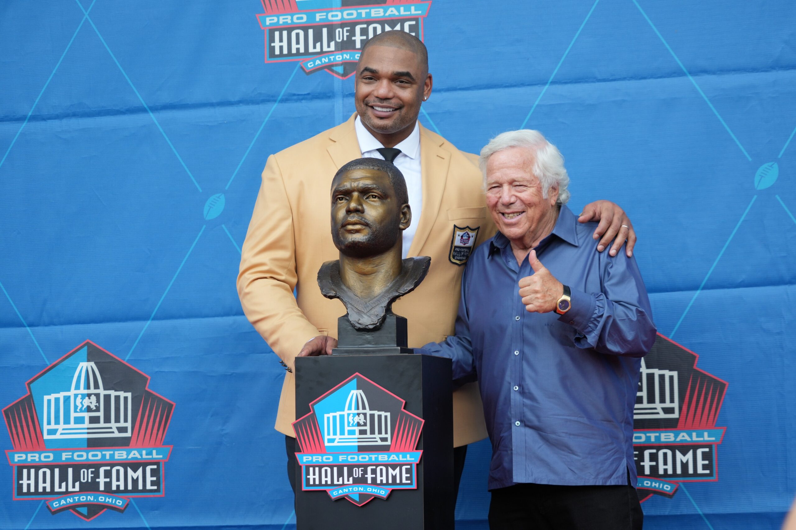 Aug 6, 2022; Canton, OH, USA; Richard Seymour with New England Patriots owner Robert Kraft and his bust during the Pro Football Hall of Fame Class of 2022 enshrinement  ceremony at Tom Benson Hall of Fame Stadium. Mandatory Credit: Kirby Lee-USA TODAY Sports