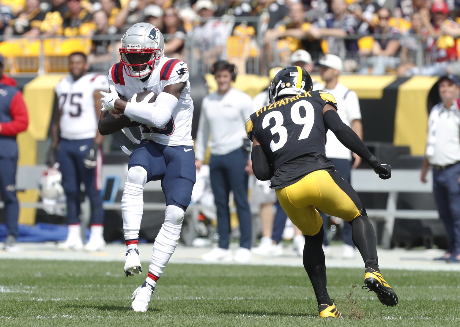 Sep 18, 2022; Pittsburgh, Pennsylvania, USA;  New England Patriots wide receiver Nelson Agholor (15) makes a catch as Pittsburgh Steelers safety Minkah Fitzpatrick (39) defends during the first quarter at Acrisure Stadium. Mandatory Credit: Charles LeClaire-USA TODAY Sports