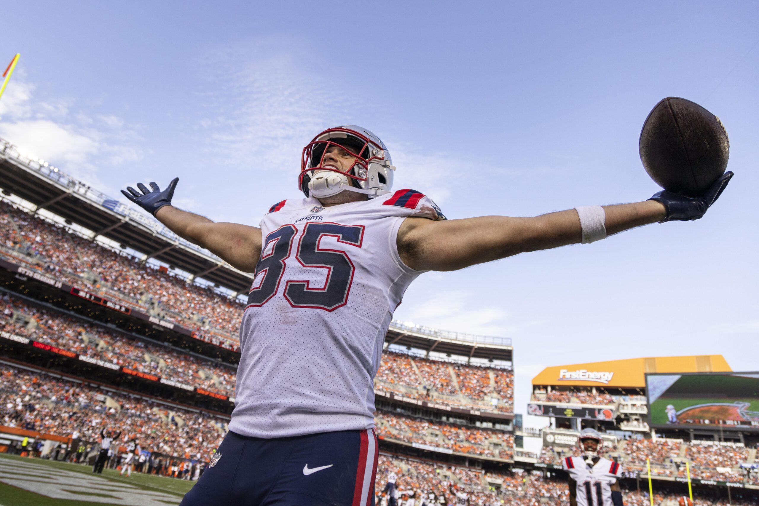 Oct 16, 2022; Cleveland, Ohio, USA; New England Patriots tight end Hunter Henry (85) celebrates his touchdown run against the Cleveland Browns during the third quarter at FirstEnergy Stadium. Mandatory Credit: Scott Galvin-USA TODAY Sports