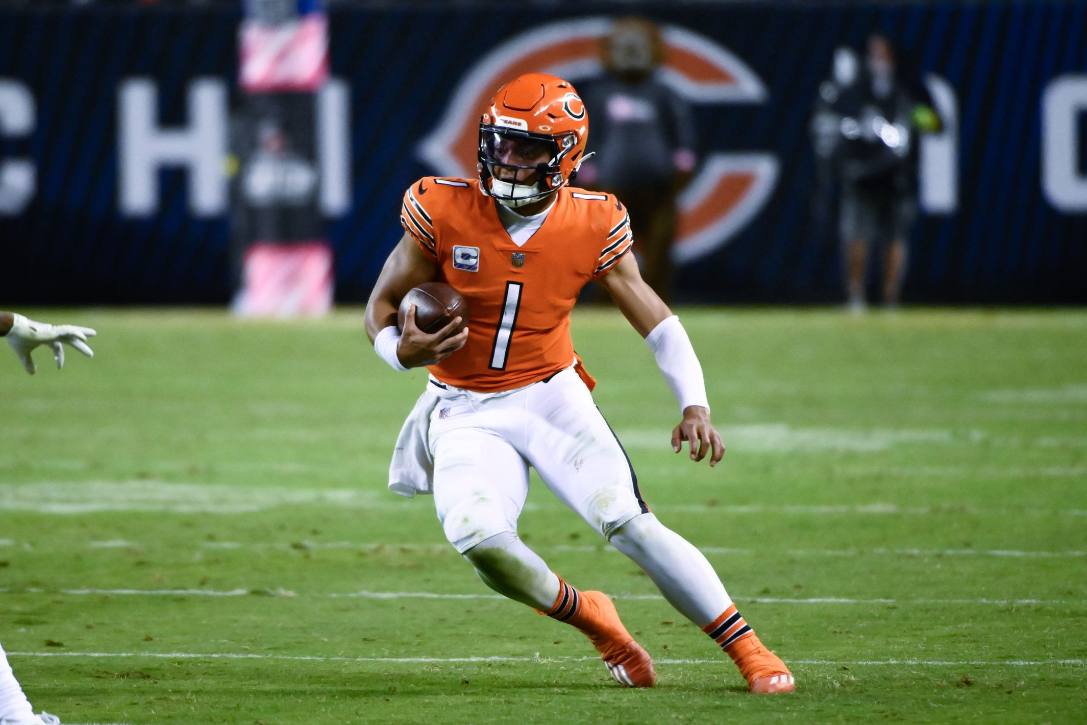 Oct 13, 2022; Chicago, Illinois, USA; Chicago Bears quarterback Justin Fields (1) runs with the ball against the Washington Commanders  during the second half at Soldier Field. Mandatory Credit: Matt Marton-USA TODAY Sports