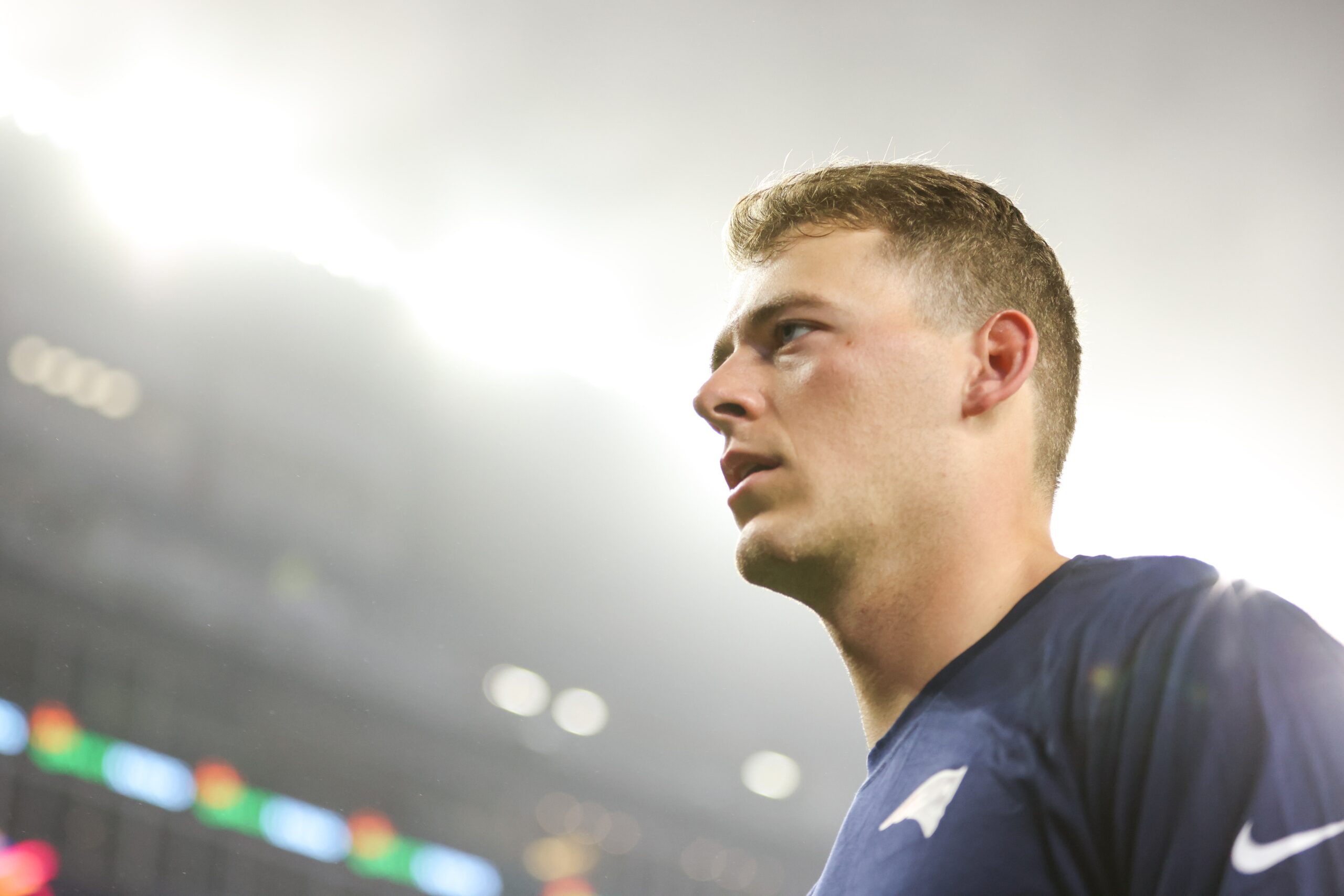 Oct 24, 2022; Foxborough, Massachusetts, USA; New England Patriots quarterback Mac Jones (10) reacts before a game against the Chicago Bears at Gillette Stadium. Mandatory Credit: Paul Rutherford-USA TODAY Sports