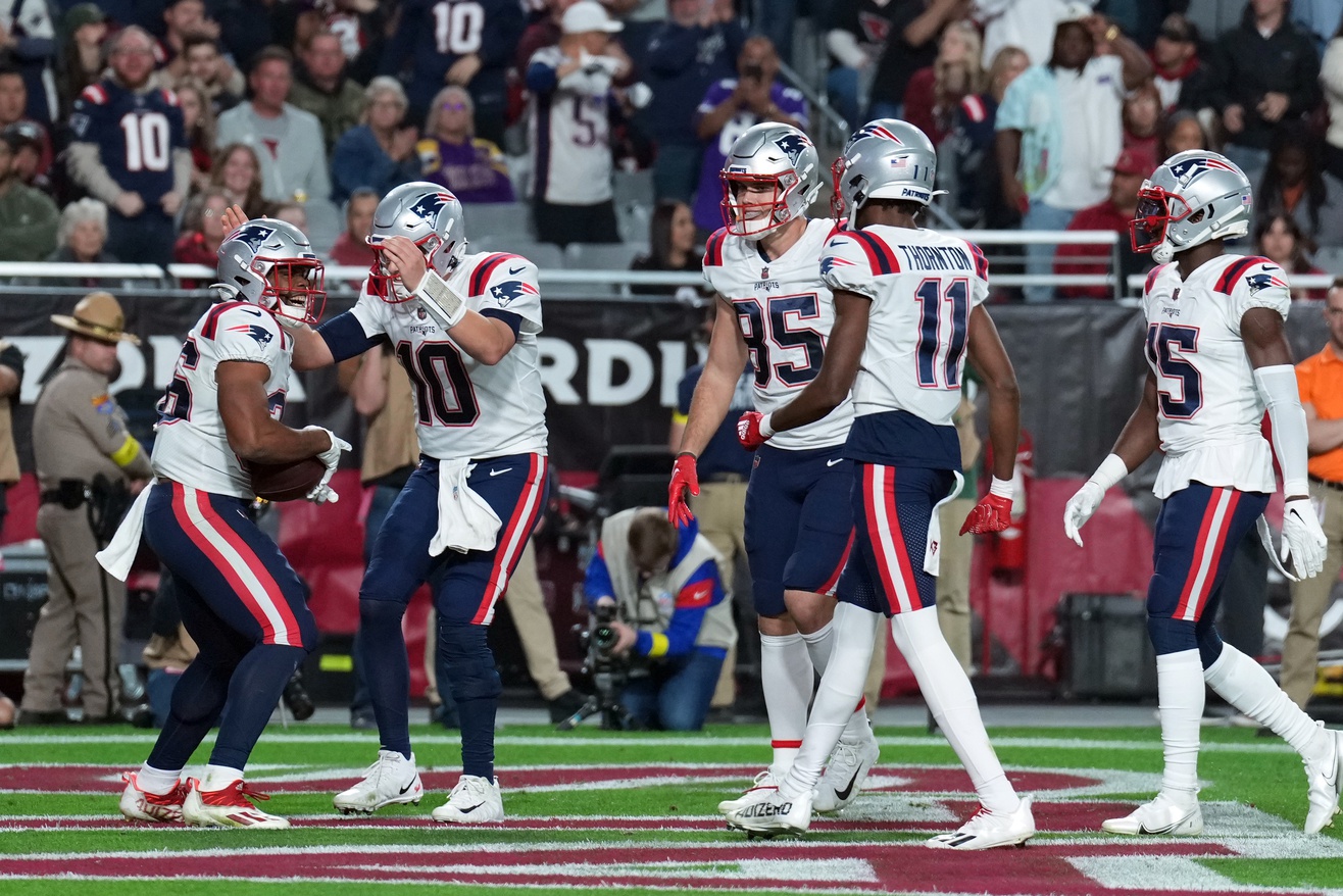 Dec 12, 2022; Glendale, Arizona, USA; New England Patriots running back Kevin Harris (36) celebrates his touchdown against the Arizona Cardinals during the first half at State Farm Stadium. Mandatory Credit: Joe Camporeale-USA TODAY Sports