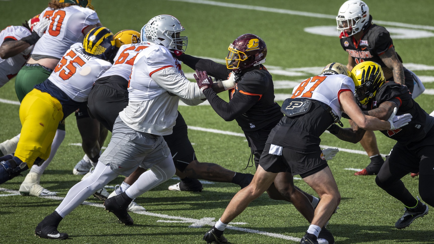 Jan 31, 2023; Mobile, AL, USA; National offensive lineman Dawand Jones of Ohio State (79) battles National defensive lineman Thomas Incoom of Central Michigan (8) during the first day of Senior Bowl week at Hancock Whitney Stadium in Mobile. Mandatory Credit: Vasha Hunt-USA TODAY Sports