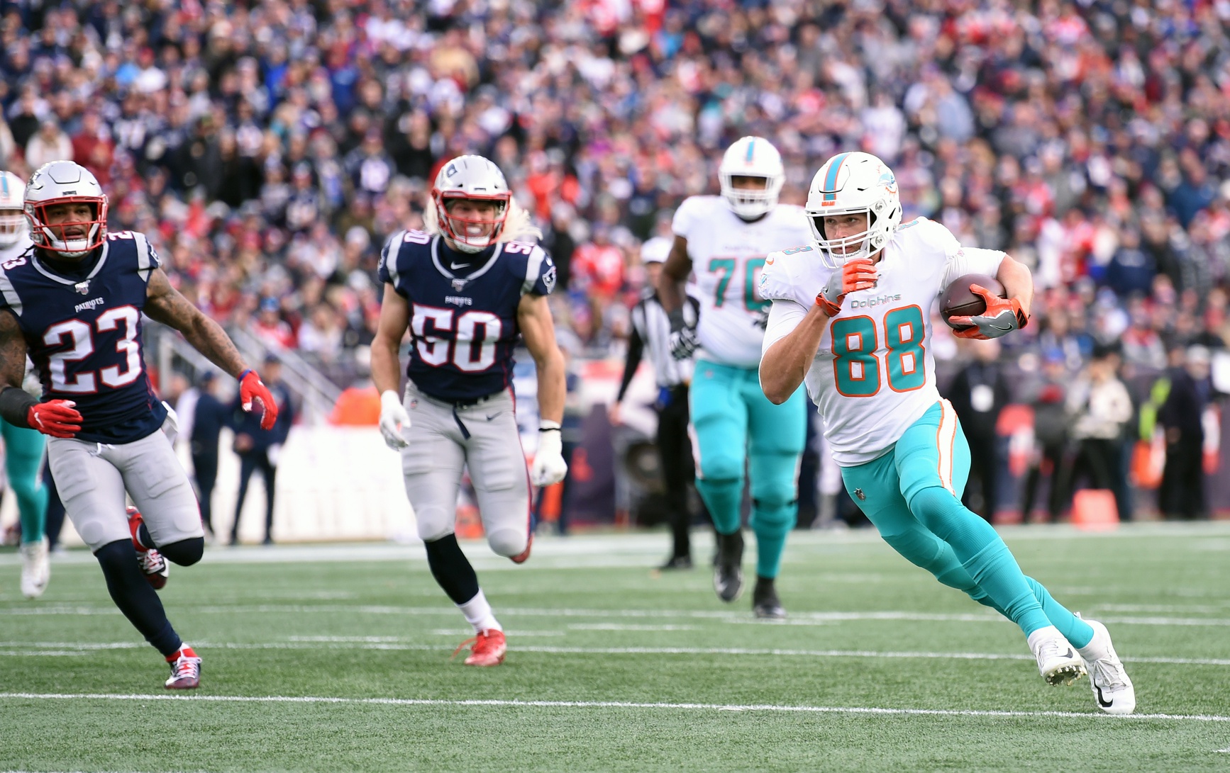 Dec 29, 2019; Foxborough, Massachusetts, USA; Miami Dolphins tight end Mike Gesicki (88) runs the ball after a catch during the second half against the New England Patriots at Gillette Stadium. Mandatory Credit: Bob DeChiara-USA TODAY Sports