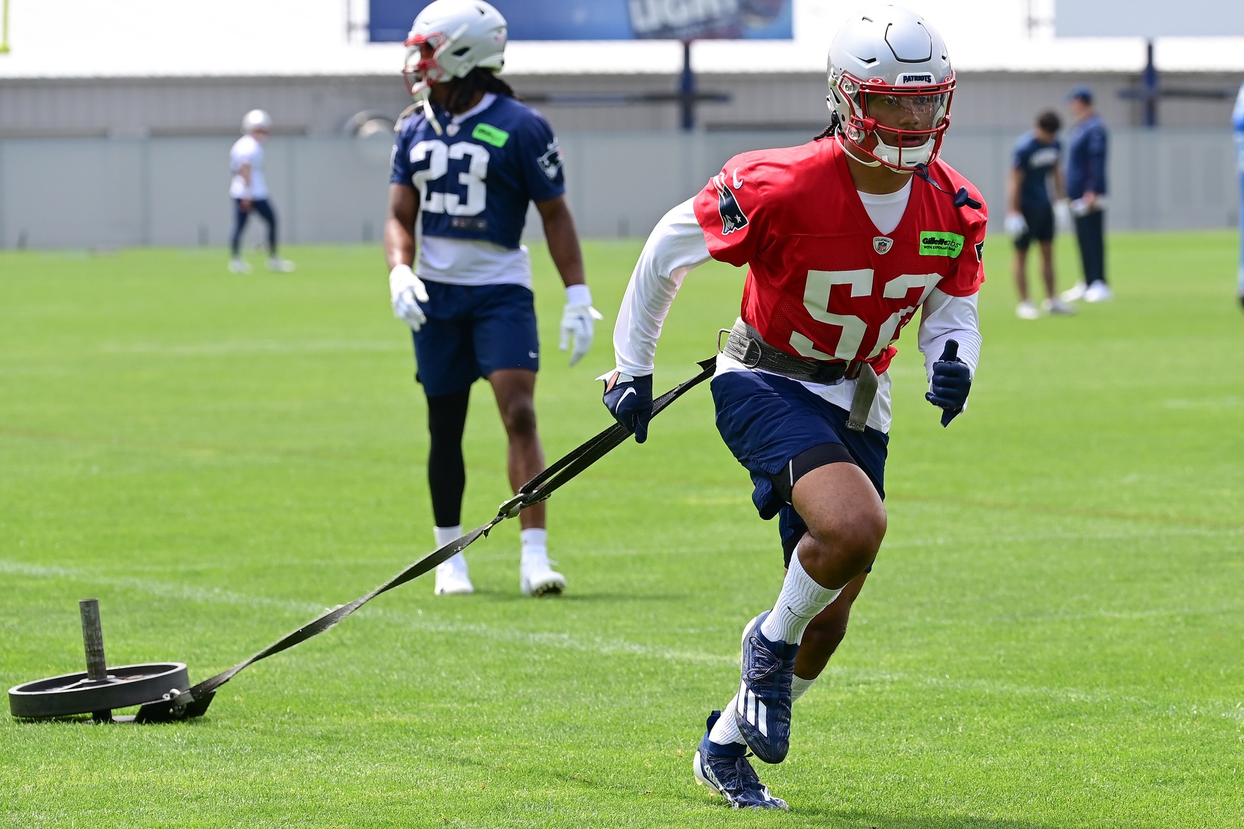 Jun 12, 2023; Foxborough, MA, USA; New England Patriots linebacker Marte Mapu (52) pulls a sled at the Patriots minicamp at Gillette Stadium. Mandatory Credit: Eric Canha-USA TODAY Sports