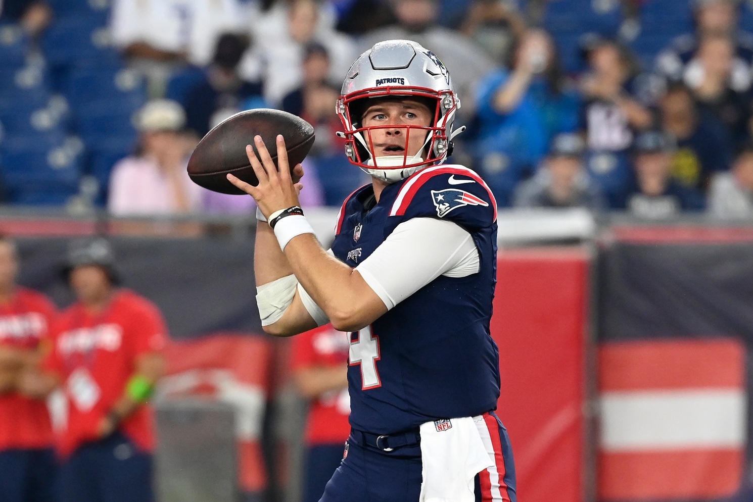 Aug 10, 2023; Foxborough, Massachusetts, USA; New England Patriots quarterback Bailey Zappe (4) looks to make a pass during the first half against the Houston Texans at Gillette Stadium. Mandatory Credit: Eric Canha-USA TODAY Sports