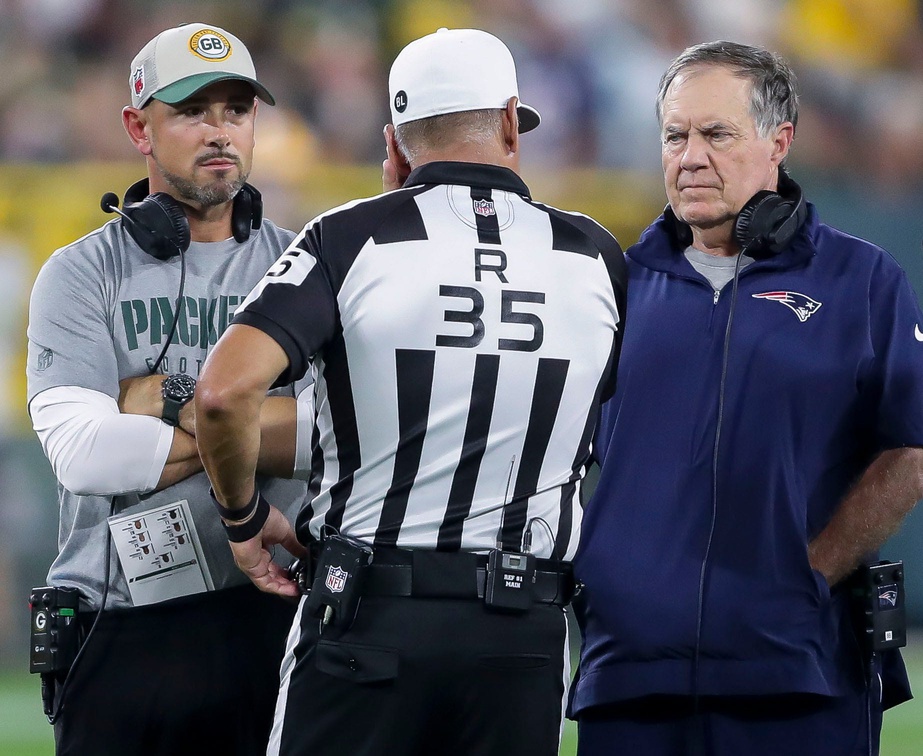Green Bay Packers head coach Matt LaFleur and New England Patriots head coach Bill Belichick talk with referee John Hussey (35) during their football game Saturday, August 19, 2023, at Lambeau Field in Green Bay, Wis. The game was suspended in the fourth quarter following an injury to New England Patriots cornerback Isaiah Bolden (7).
Tork Mason/USA TODAY NETWORK-Wisconsin