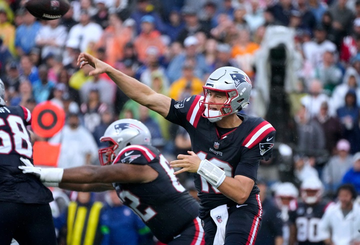 Mac Jones throws while scrambling out of the pocket in the 2nd quarter. The New England Patriots host the Philadelphia Eagles in their home opener at Gillette Stadium on Sept 10, 2023. [The Providence Journal / Kris Craig]