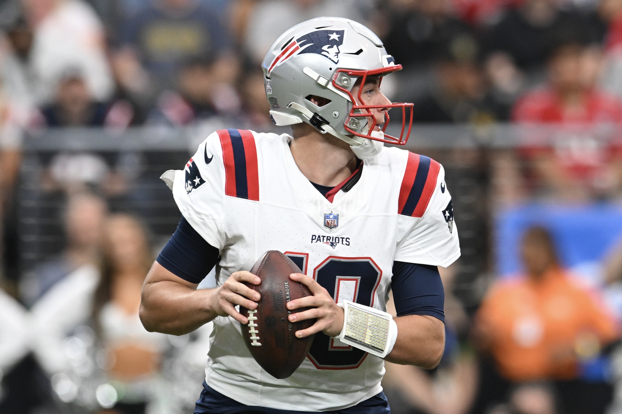 Oct 15, 2023; Paradise, Nevada, USA; New England Patriots quarterback Mac Jones (10) looks to make a pass in the first quarter against the Las Vegas Raiders at Allegiant Stadium. Mandatory Credit: Candice Ward-USA TODAY Sports