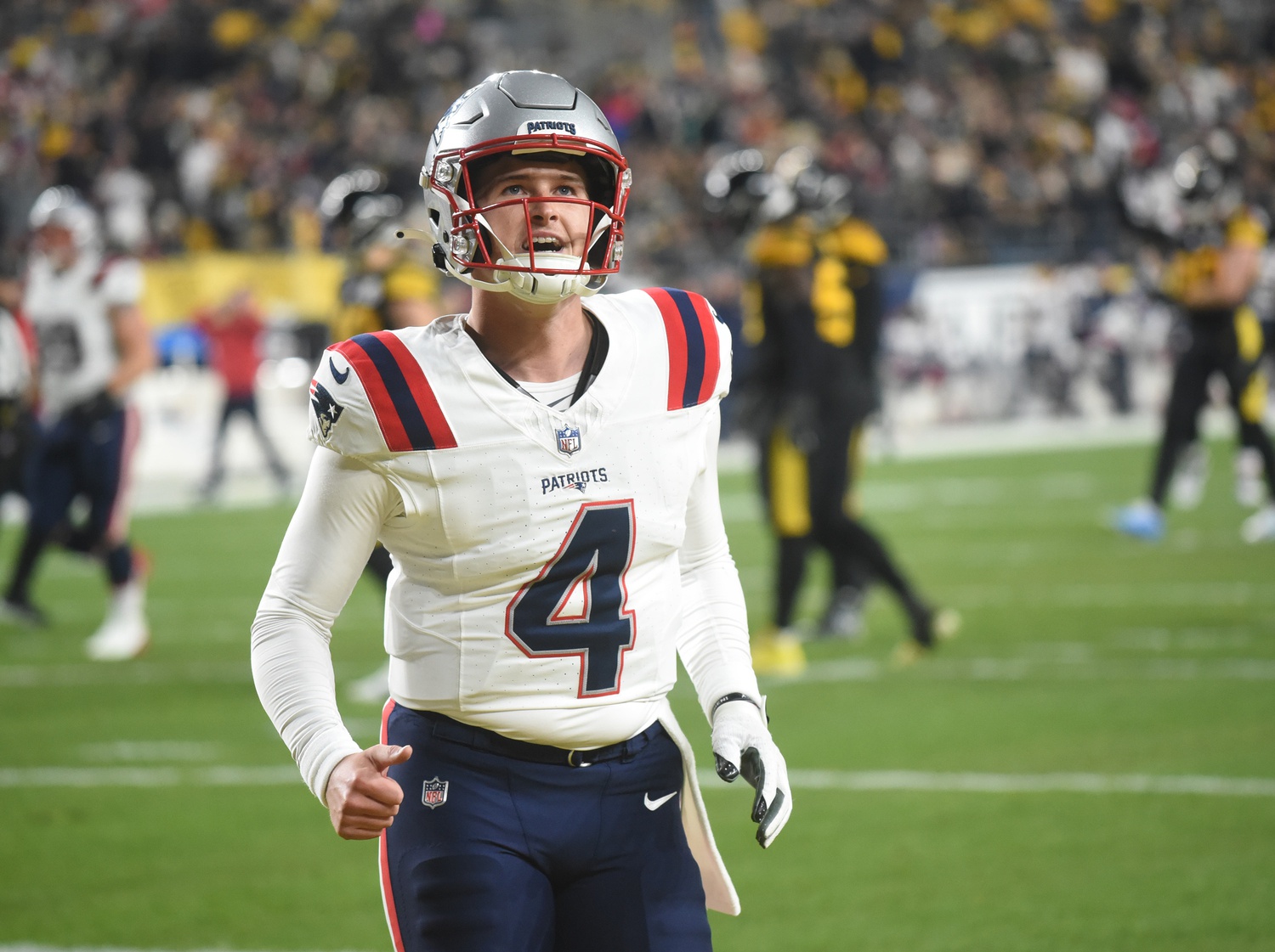 Dec 7, 2023; Pittsburgh, Pennsylvania, USA;  New England Patriots quarterback Bailey Zappe (4) reacts after a touchdown against the Pittsburgh Steelers during the second quarter at Acrisure Stadium. Mandatory Credit: Philip G. Pavely-USA TODAY Sports