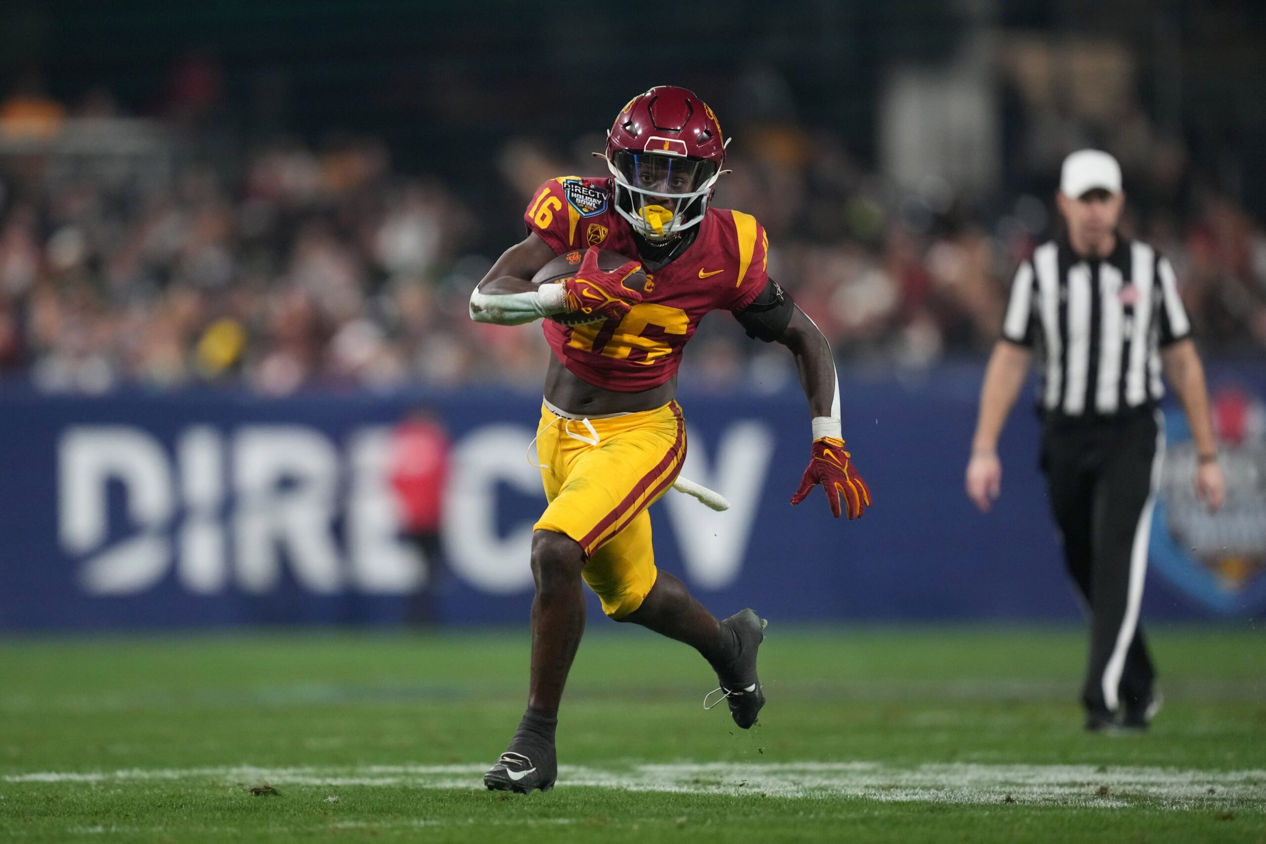 Dec 27, 2023; San Diego, CA, USA; Southern California Trojans wide receiver Tahj Washington (16) carries the ball against the Louisville Cardinals in the second half of the Holiday Bowl against the Louisville Cardinals at Petco Park. Mandatory Credit: Kirby Lee-USA TODAY Sports