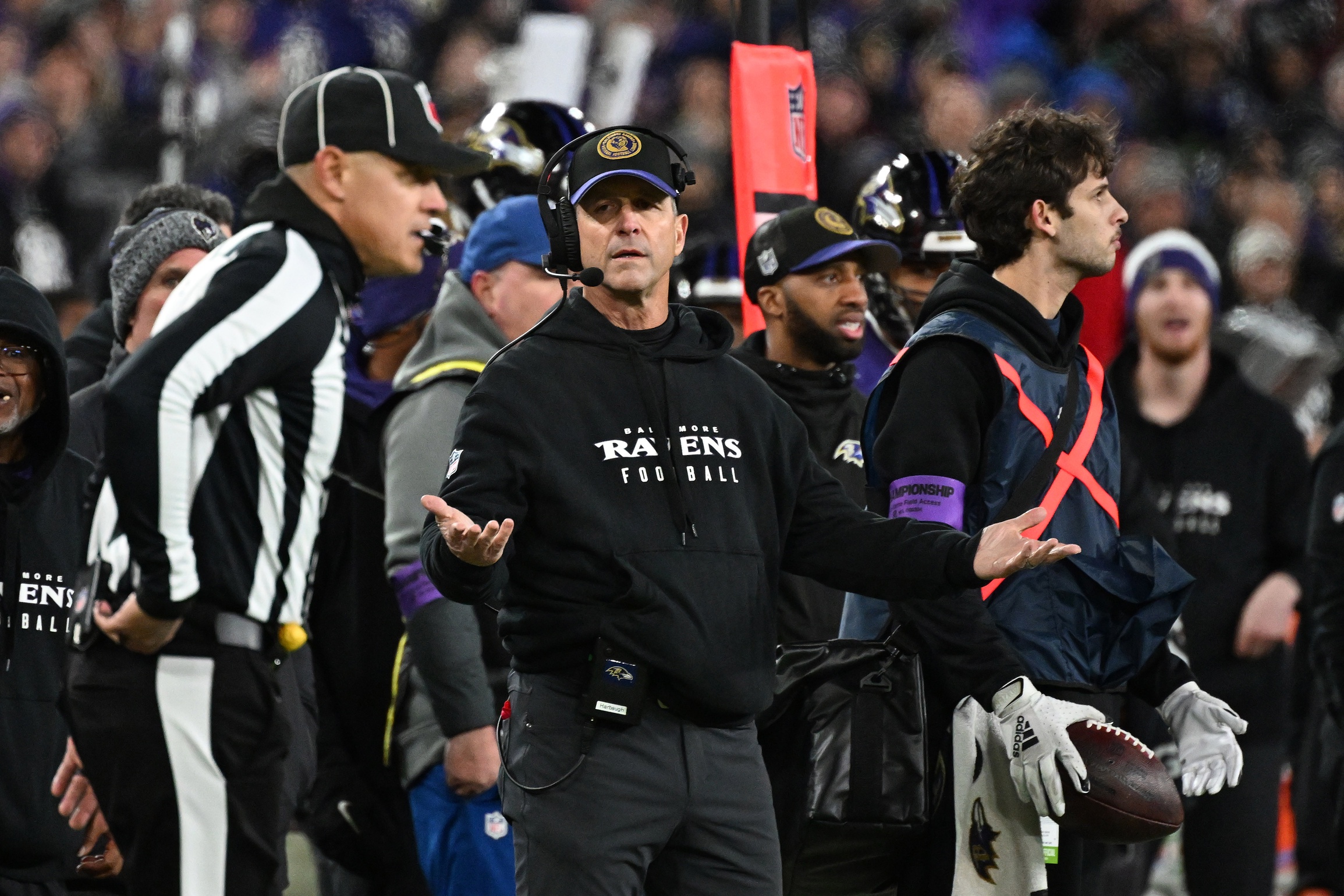 Jan 28, 2024; Baltimore, Maryland, USA; Baltimore Ravens head coach John Harbaugh (center) questions a call against the Kansas City Chiefs during the second half in the AFC Championship football game at M&T Bank Stadium. Mandatory Credit: Tommy Gilligan-USA TODAY Sports