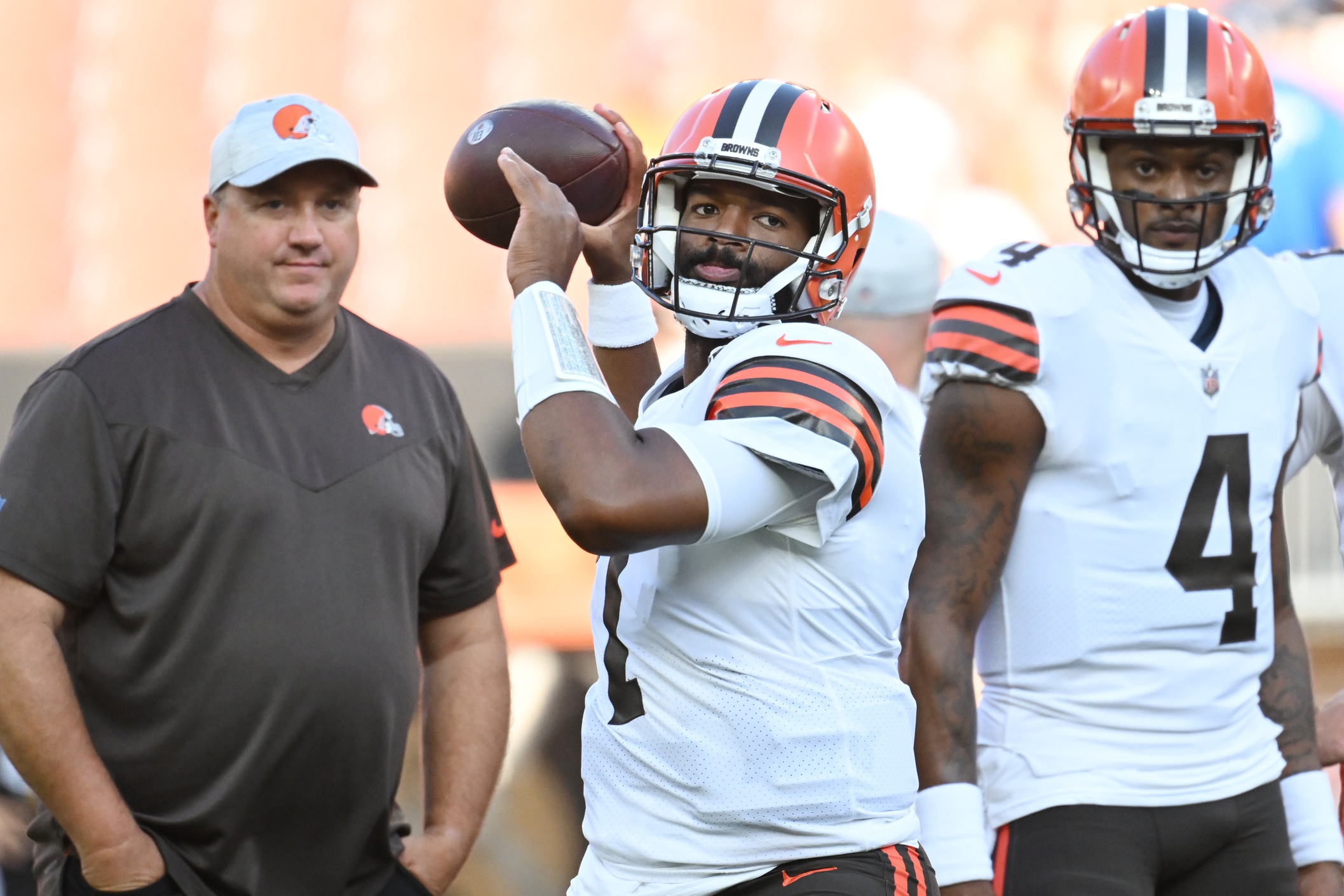 Aug 27, 2022; Cleveland, Ohio, USA;  Cleveland Browns quarterback Jacoby Brissett (7) warms up as offensive coordinator Alex Van Pelt, left, and quarterback Deshaun Watson (4) watch before the game between the Browns and the Chicago Bears at FirstEnergy Stadium. Mandatory Credit: Ken Blaze-USA TODAY Sports