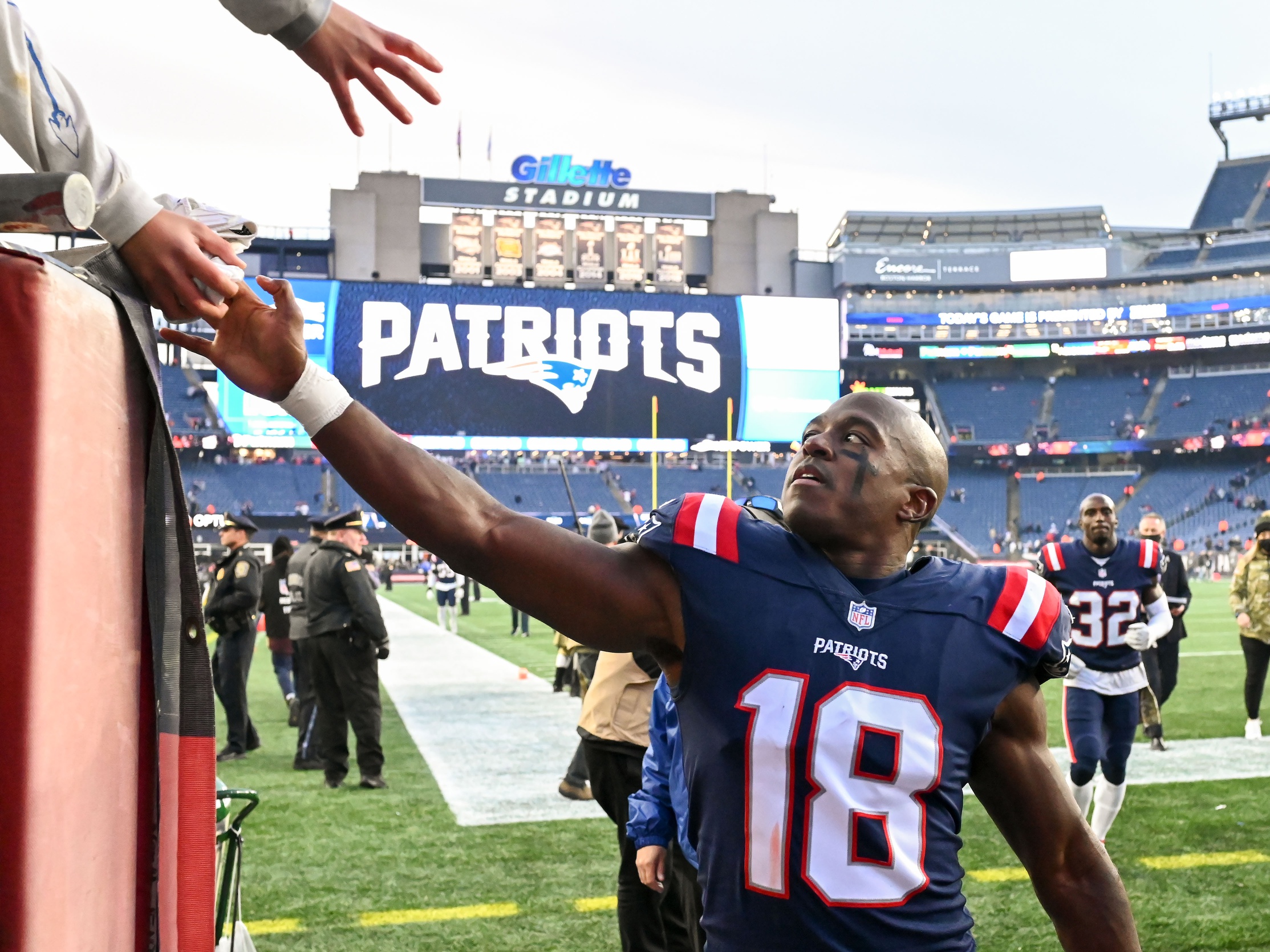 Nov 14, 2021; Foxborough, Massachusetts, USA; New England Patriots wide receiver Matthew Slater (18) gives a towel to a fan after a game against the Cleveland Browns at Gillette Stadium. Mandatory Credit: Brian Fluharty-USA TODAY Sports