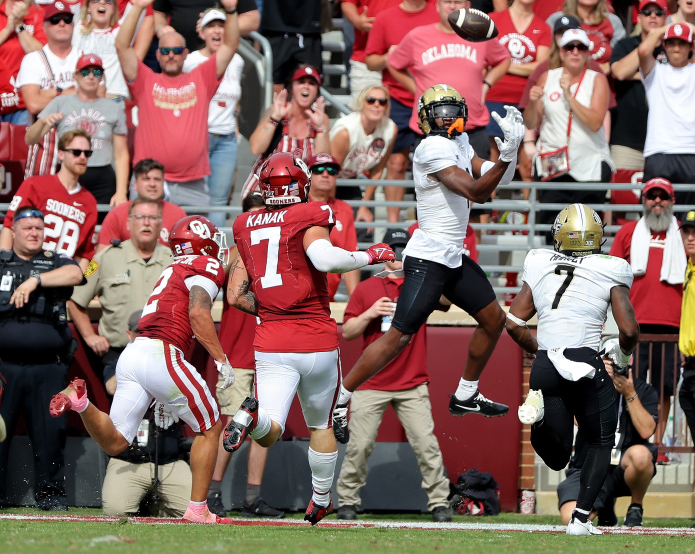UCF's Javon Baker (1) scores a touchdown in front of Oklahoma's Billy Bowman Jr. (2) and Jaren Kanak (7) in the fourth quarter of the college football game between the University of Oklahoma Sooners and the University of Central Florida Knights at Gaylord Family Oklahoma-Memorial Stadium in Norman, Okla., Saturday, Oct., 21, 2023.