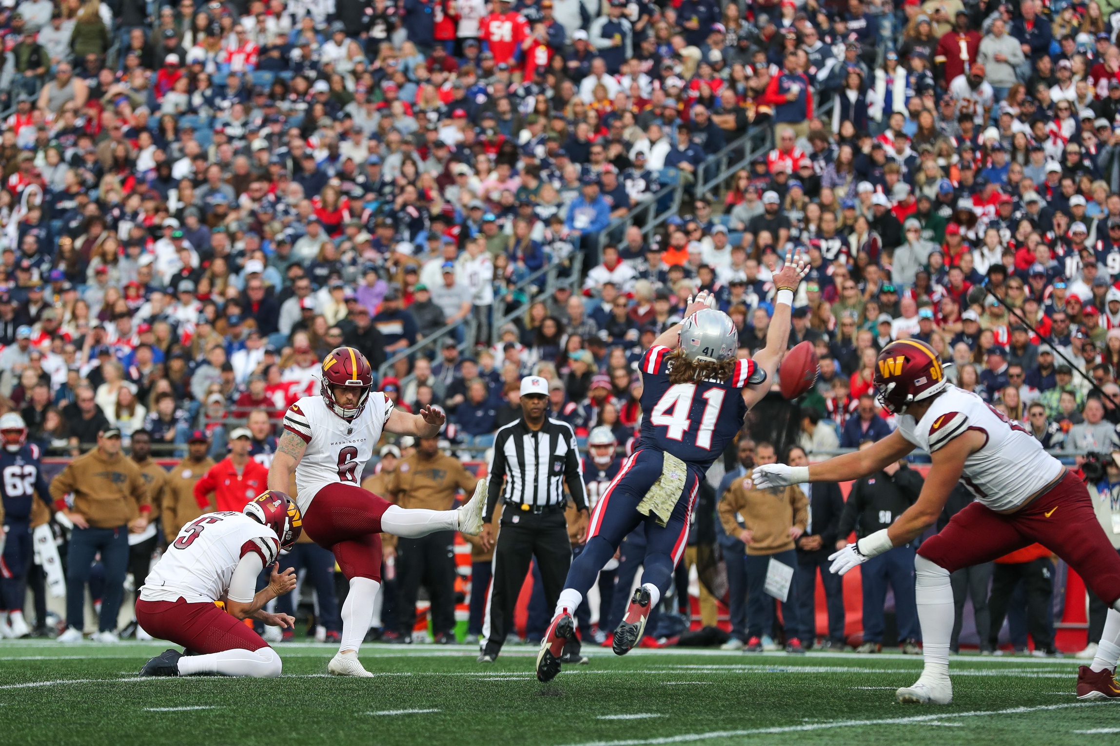 Nov 5, 2023; Foxborough, Massachusetts, USA; Washington Commanders kicker Joey Slye (6) kicks a field goal during the second half against the New England Patriots at Gillette Stadium. Mandatory Credit: Paul Rutherford-USA TODAY Sports
