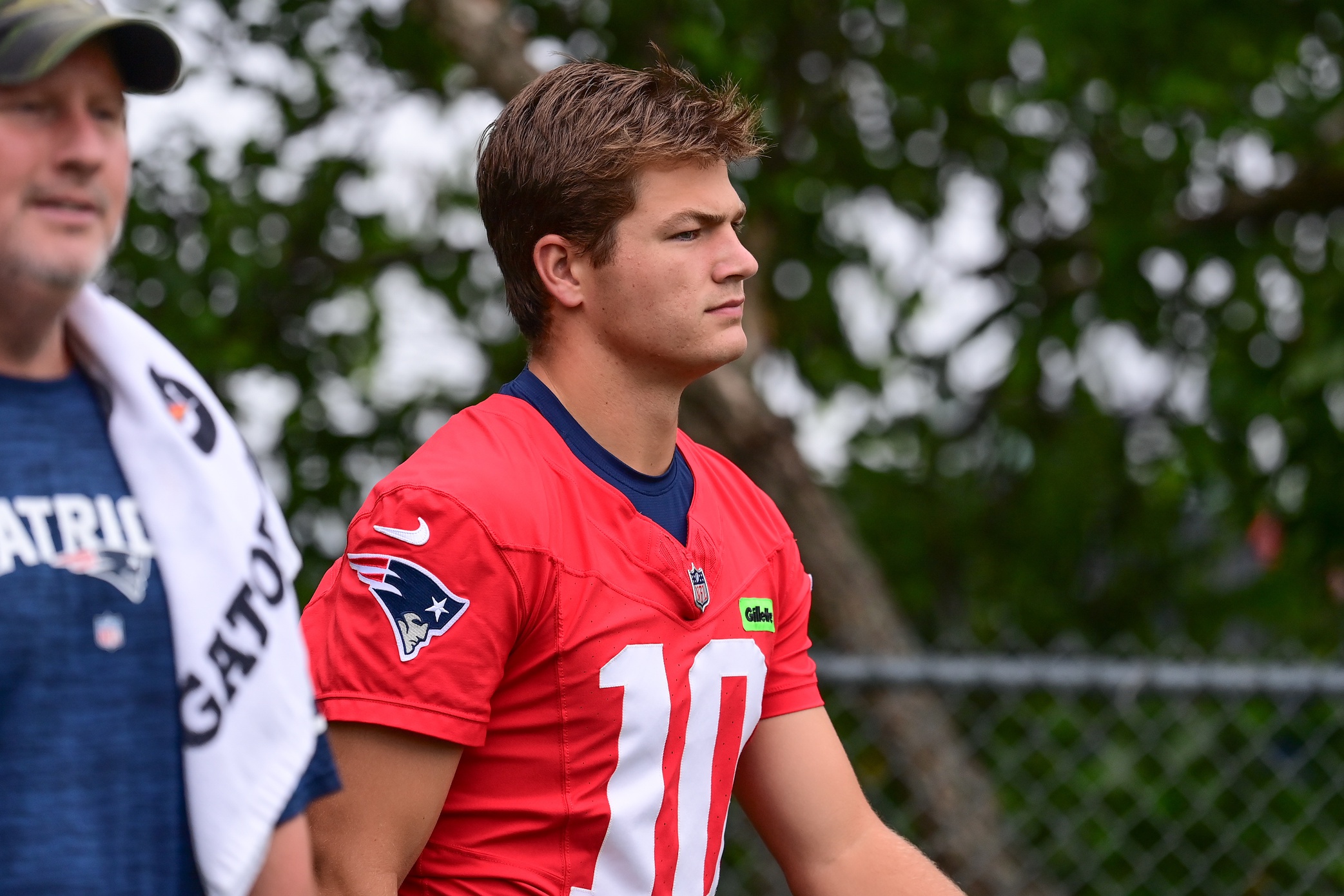Jul 24, 2024; Foxborough, MA, USA;  New England Patriots quarterback Drake Maye (10) walks to the practice field during training camp at Gillette Stadium. Mandatory Credit: Eric Canha-USA TODAY Sports