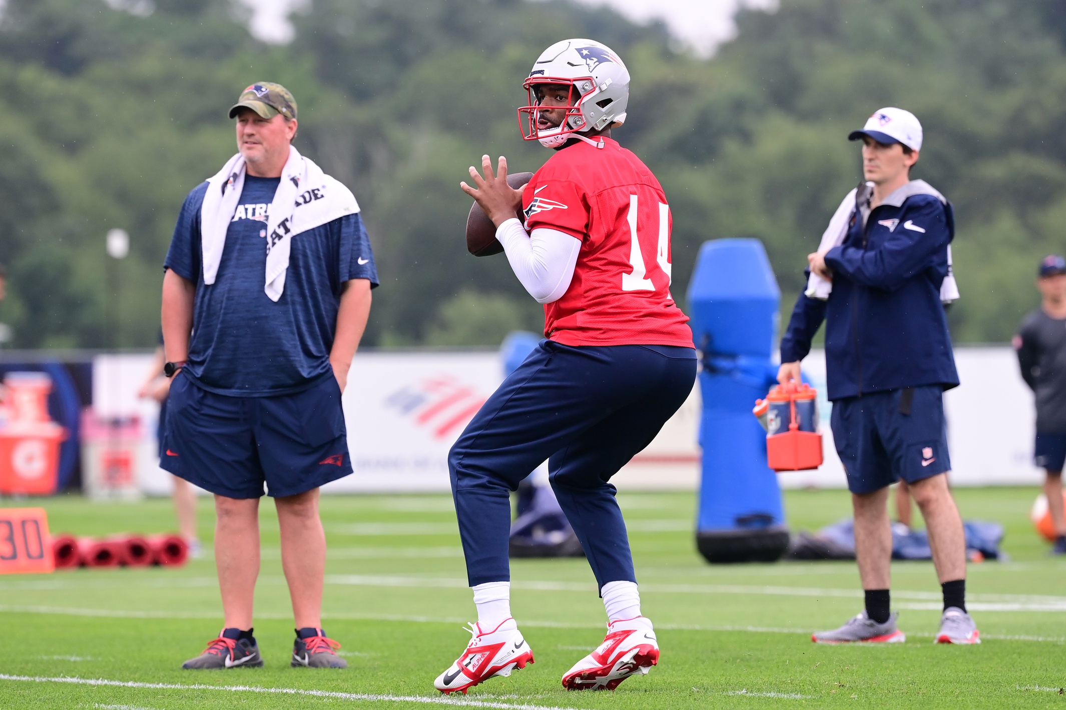 Jul 24, 2024; Foxborough, MA, USA;  New England Patriots quarterback Jacoby Brissett (14) throws a pass during training camp at Gillette Stadium. Mandatory Credit: Eric Canha-USA TODAY Sports