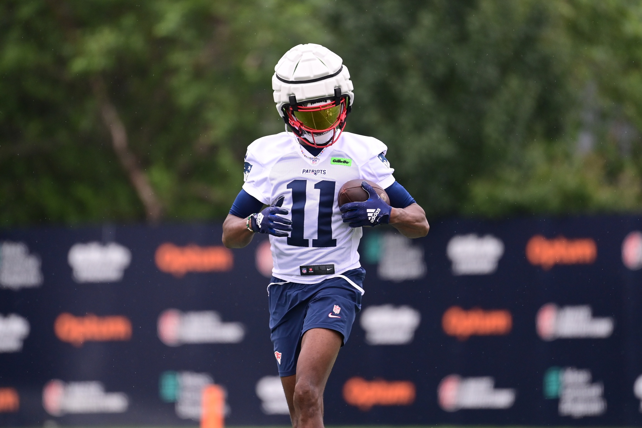 Jul 24, 2024; Foxborough, MA, USA;  New England Patriots wide receiver Tyquan Thornton (11) runs after making a catch during training camp at Gillette Stadium. Mandatory Credit: Eric Canha-USA TODAY Sports