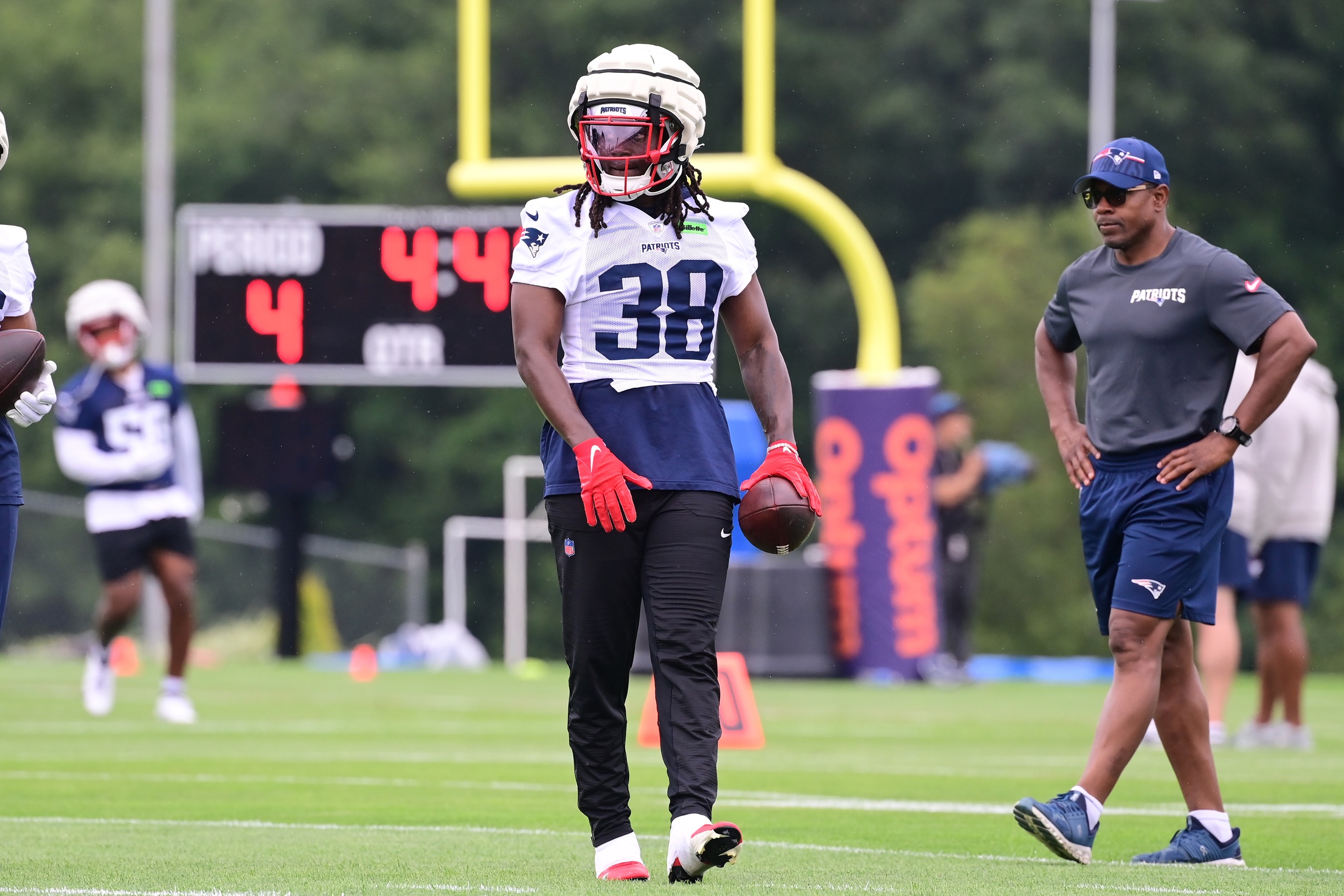 Jul 24, 2024; Foxborough, MA, USA;  New England Patriots running back Rhamondre Stevenson (38) works out during training camp at Gillette Stadium. Mandatory Credit: Eric Canha-USA TODAY Sports