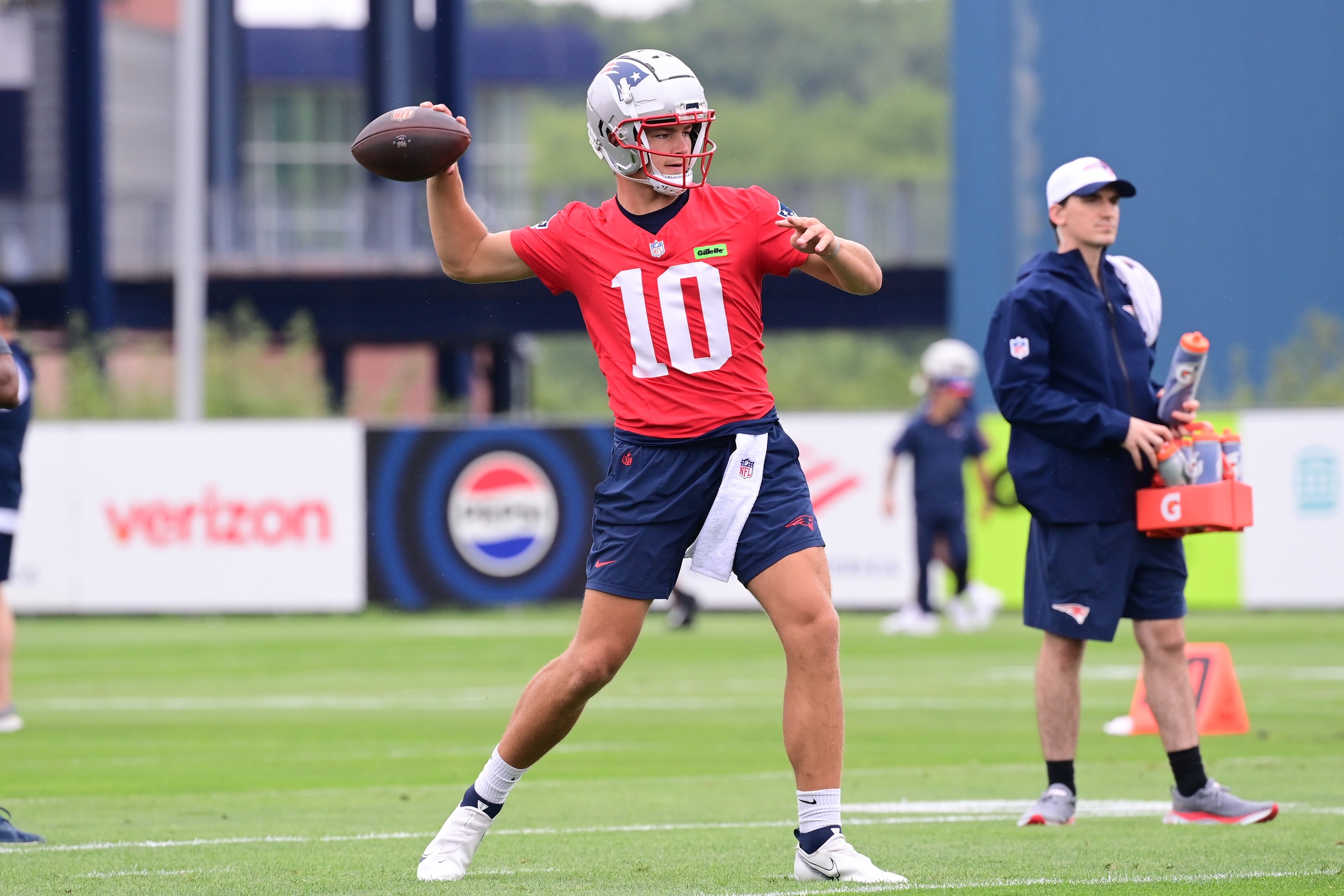 Jul 24, 2024; Foxborough, MA, USA;  New England Patriots quarterback Drake Maye (10)  throws a pass during training camp at Gillette Stadium. Mandatory Credit: Eric Canha-USA TODAY Sports