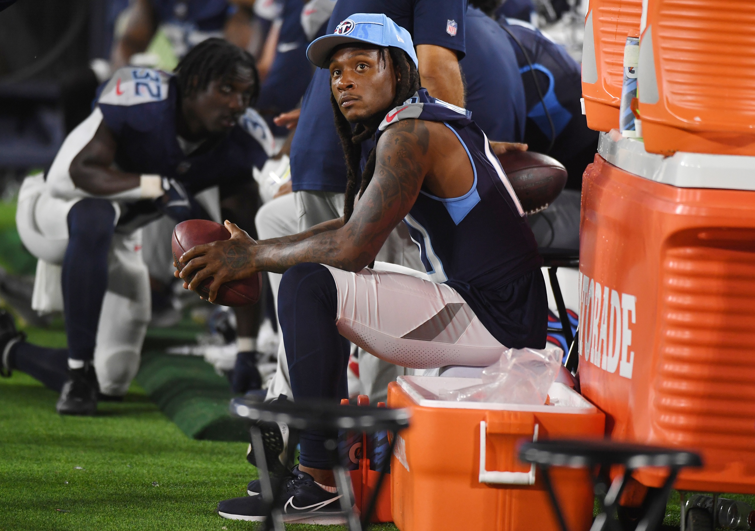 Aug 25, 2023; Nashville, Tennessee, USA; Tennessee Titans wide receiver DeAndre Hopkins (10) watches the game from the sidelines during the second half against the New England Patriots at Nissan Stadium. Mandatory Credit: Christopher Hanewinckel-USA TODAY Sports